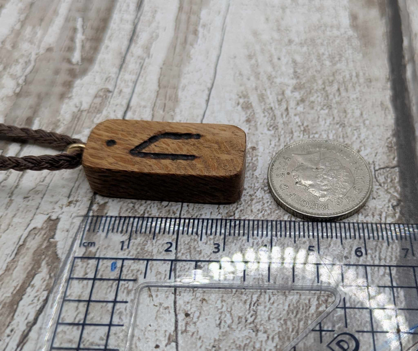 Olive wood uruz rune pendant.