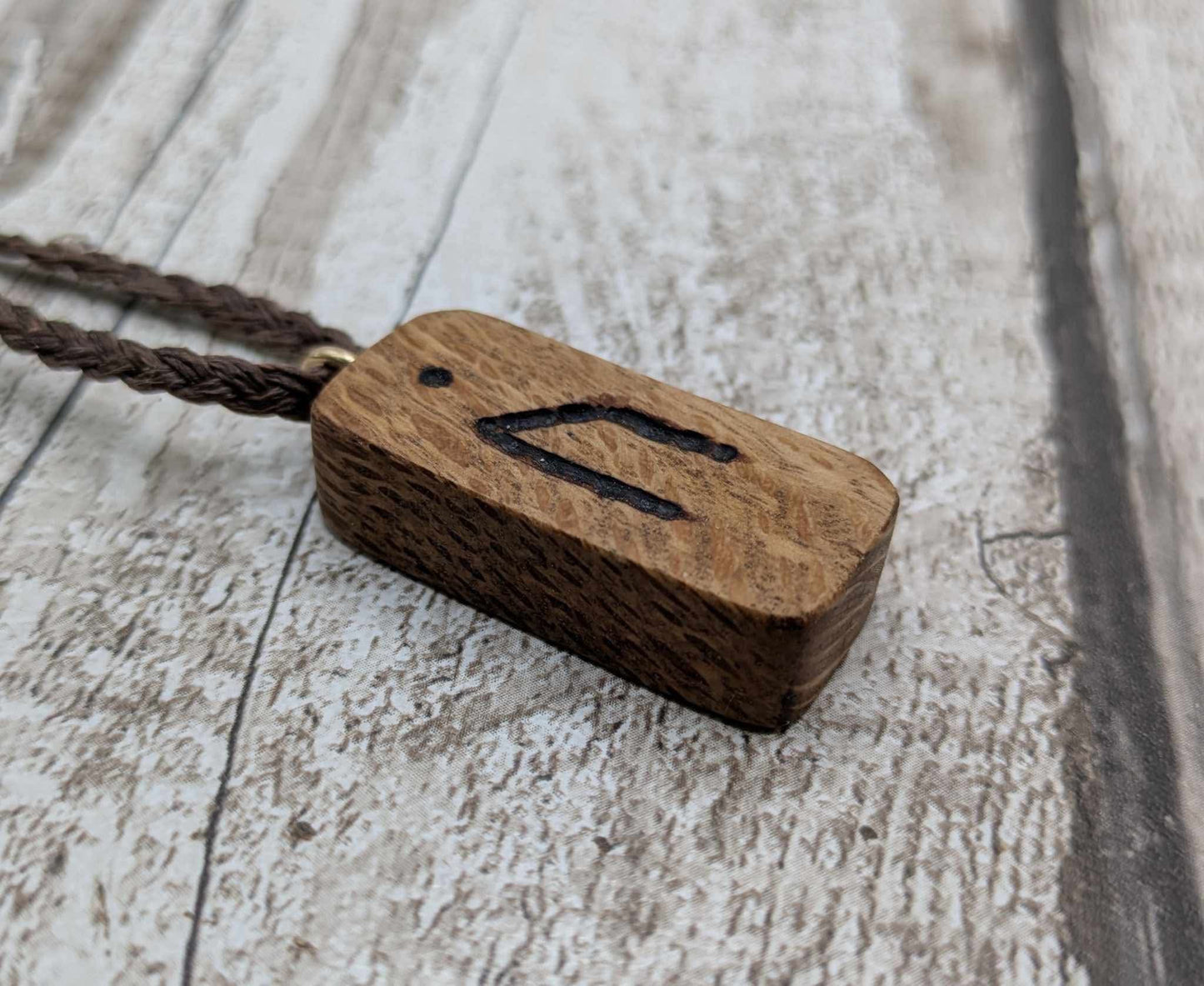 Olive wood uruz rune pendant.