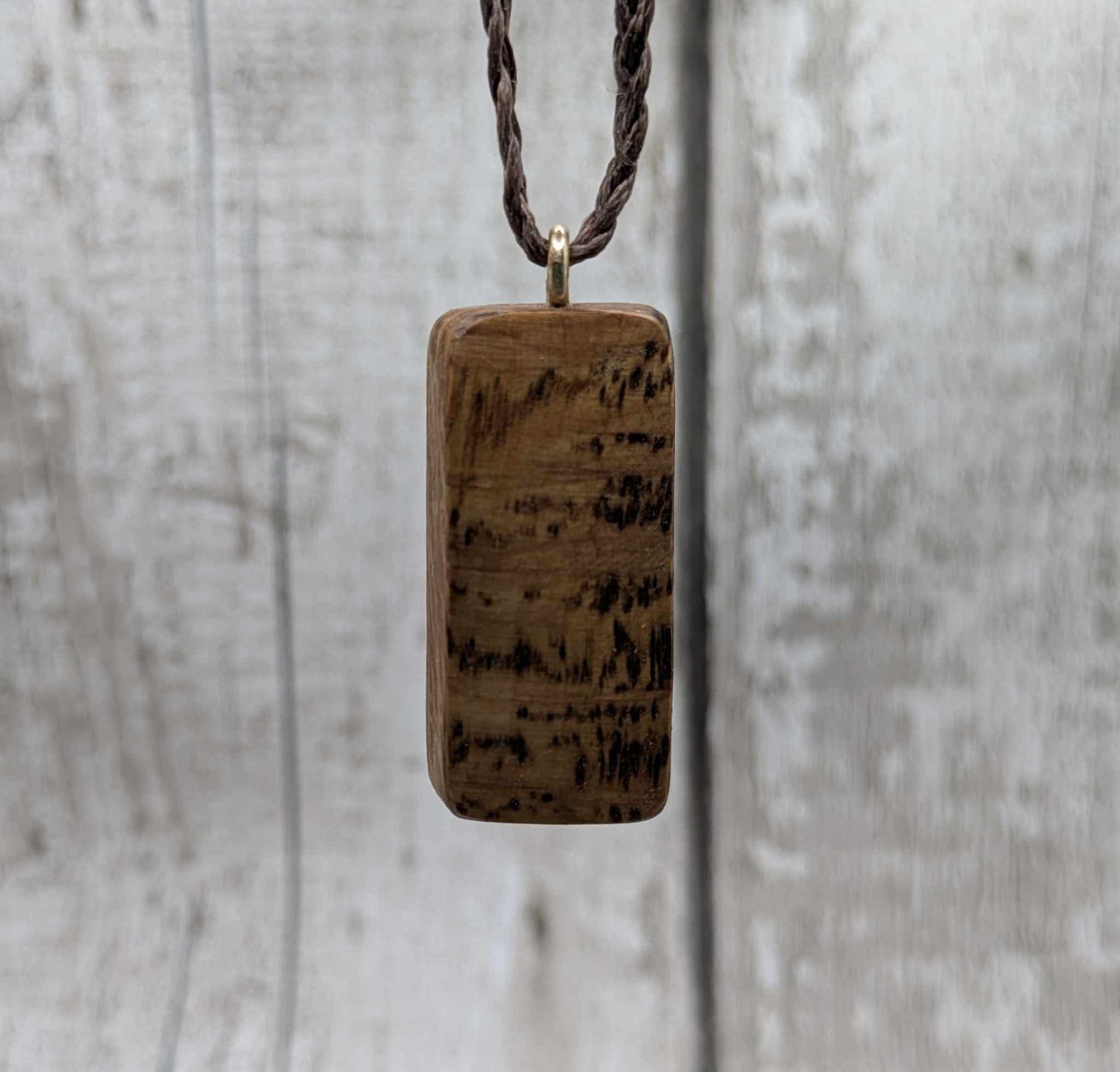 Olive wood kenaz rune pendant.