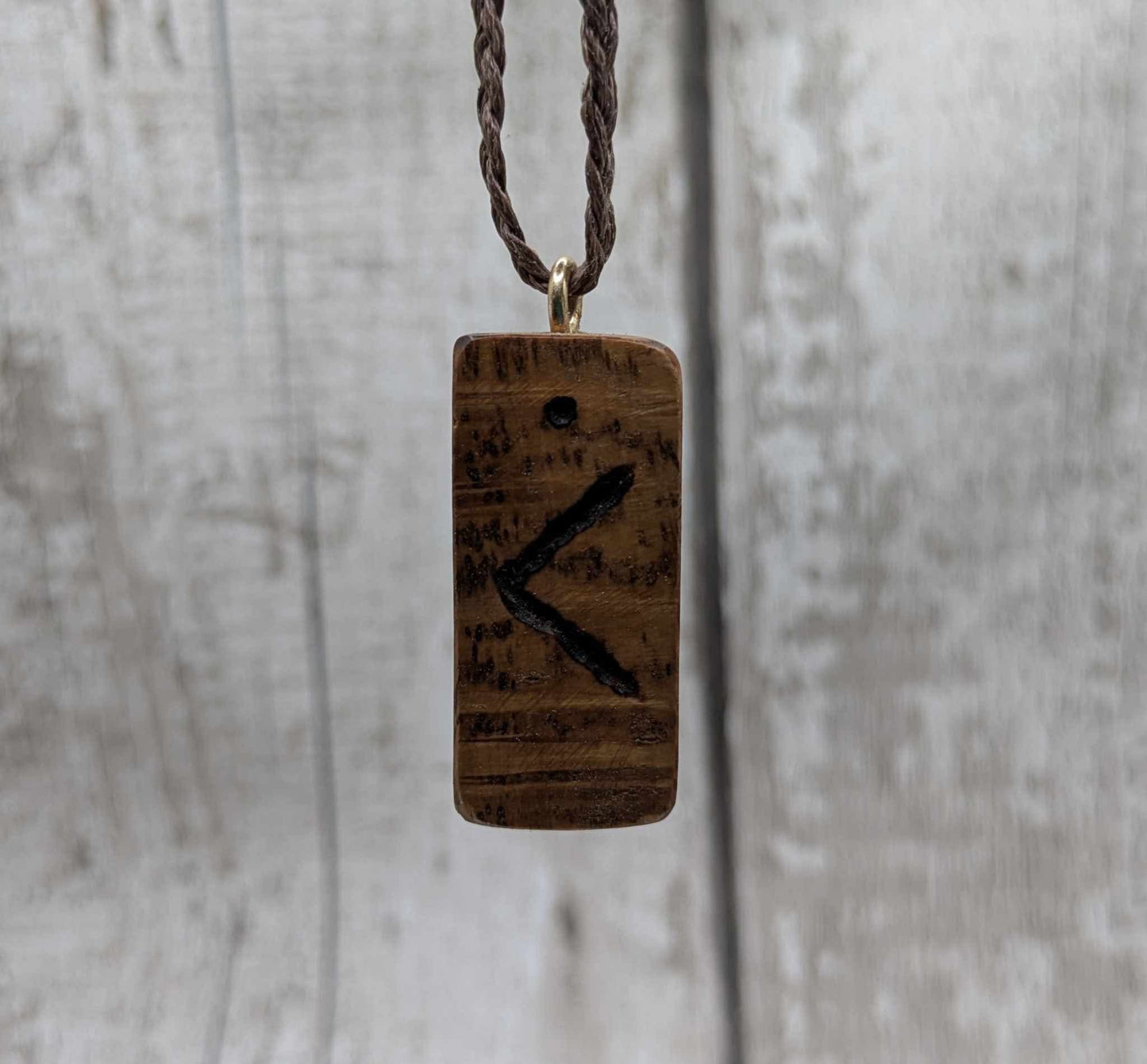 Olive wood kenaz rune pendant.