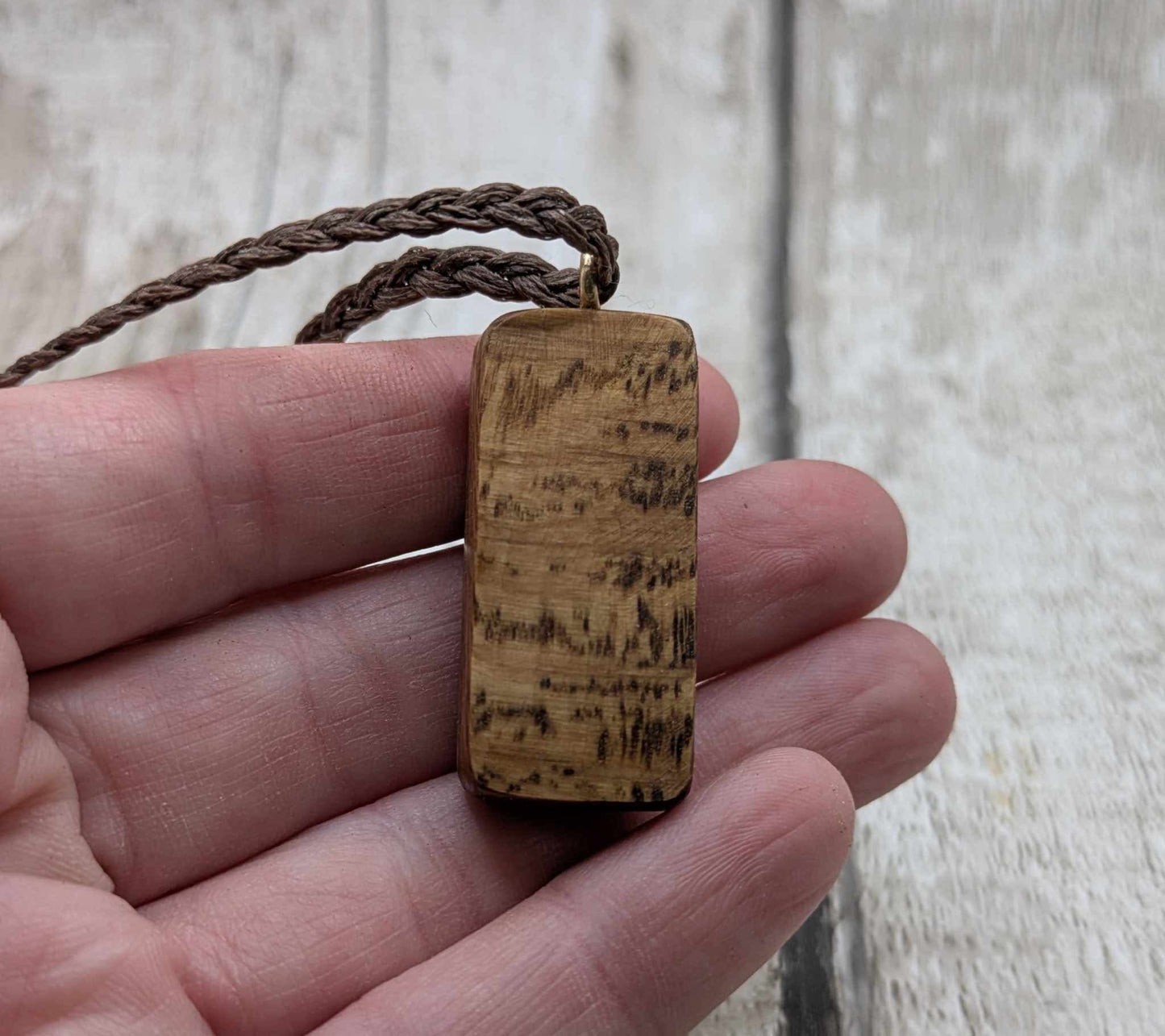 Olive wood kenaz rune pendant.