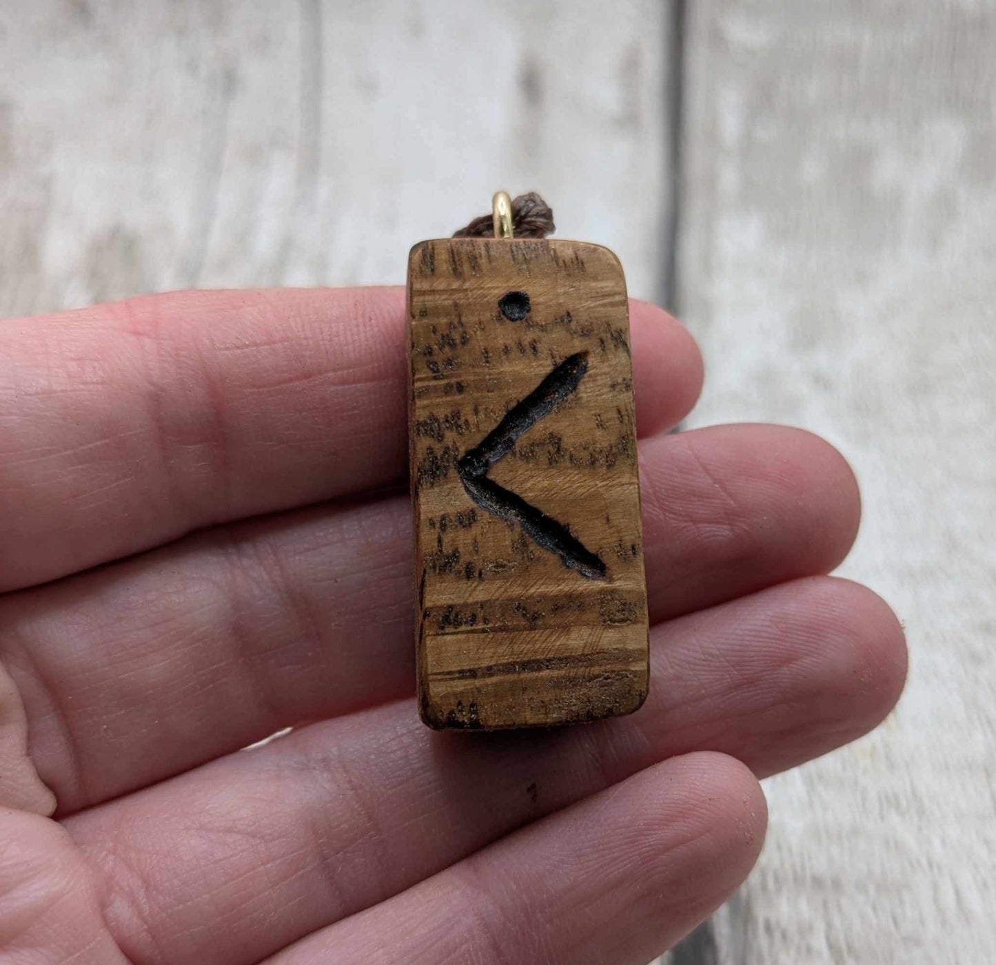 Olive wood kenaz rune pendant.