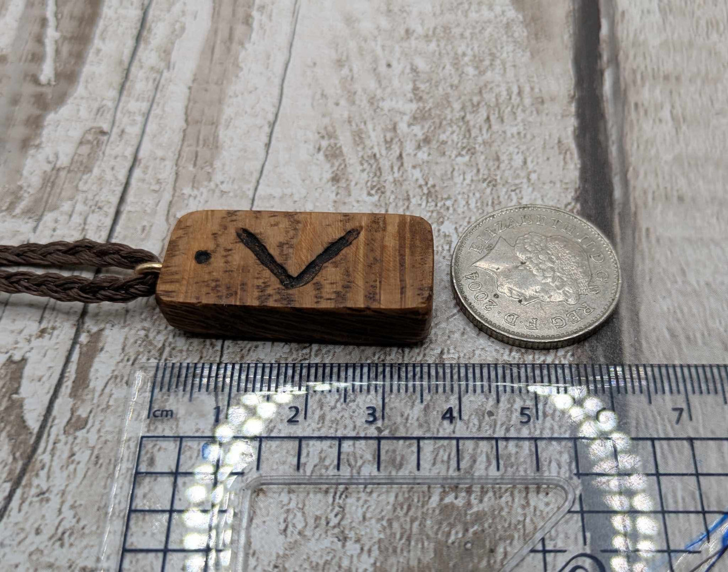 Olive wood kenaz rune pendant.
