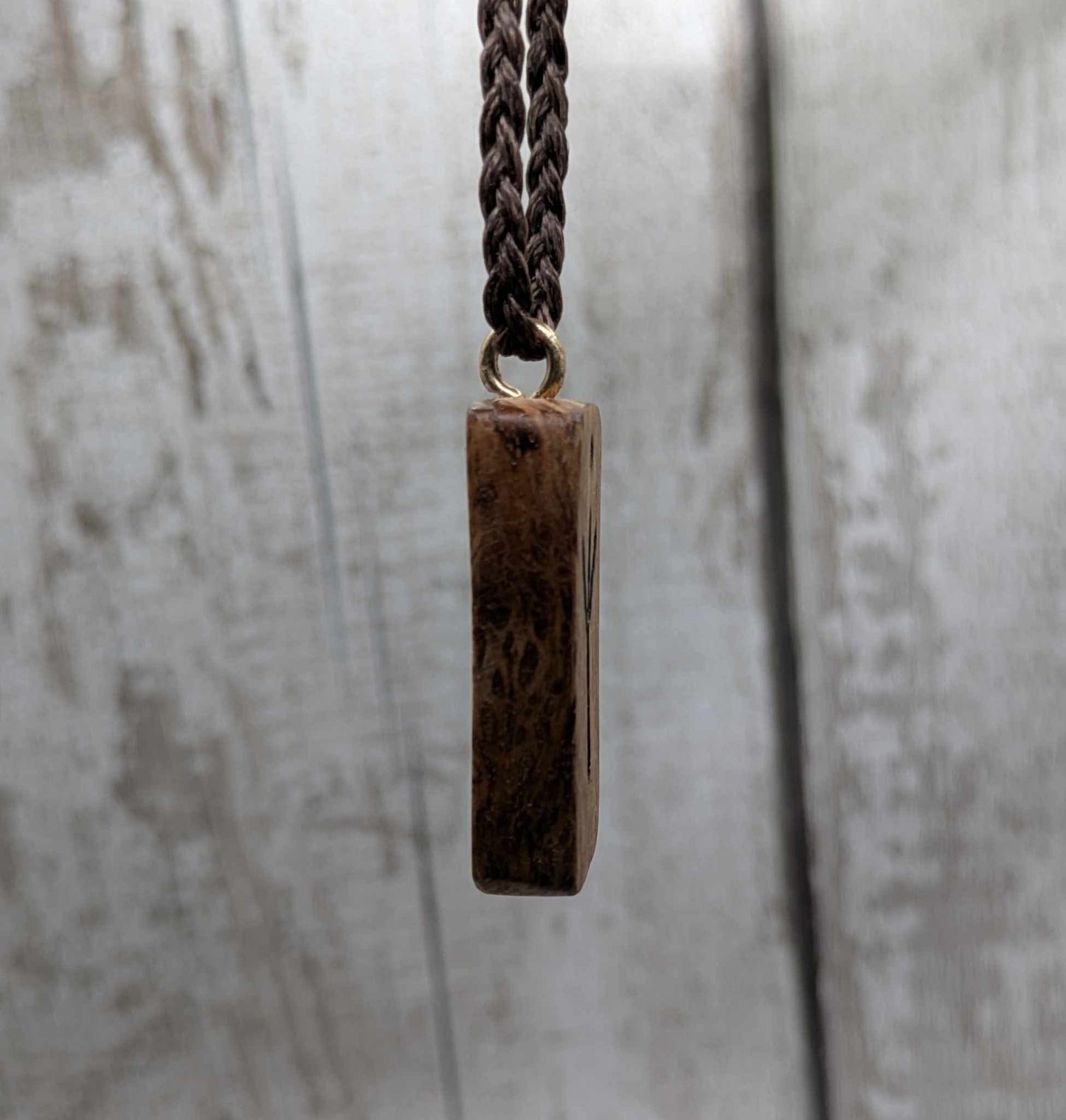 Olive wood thurisaz rune pendant.
