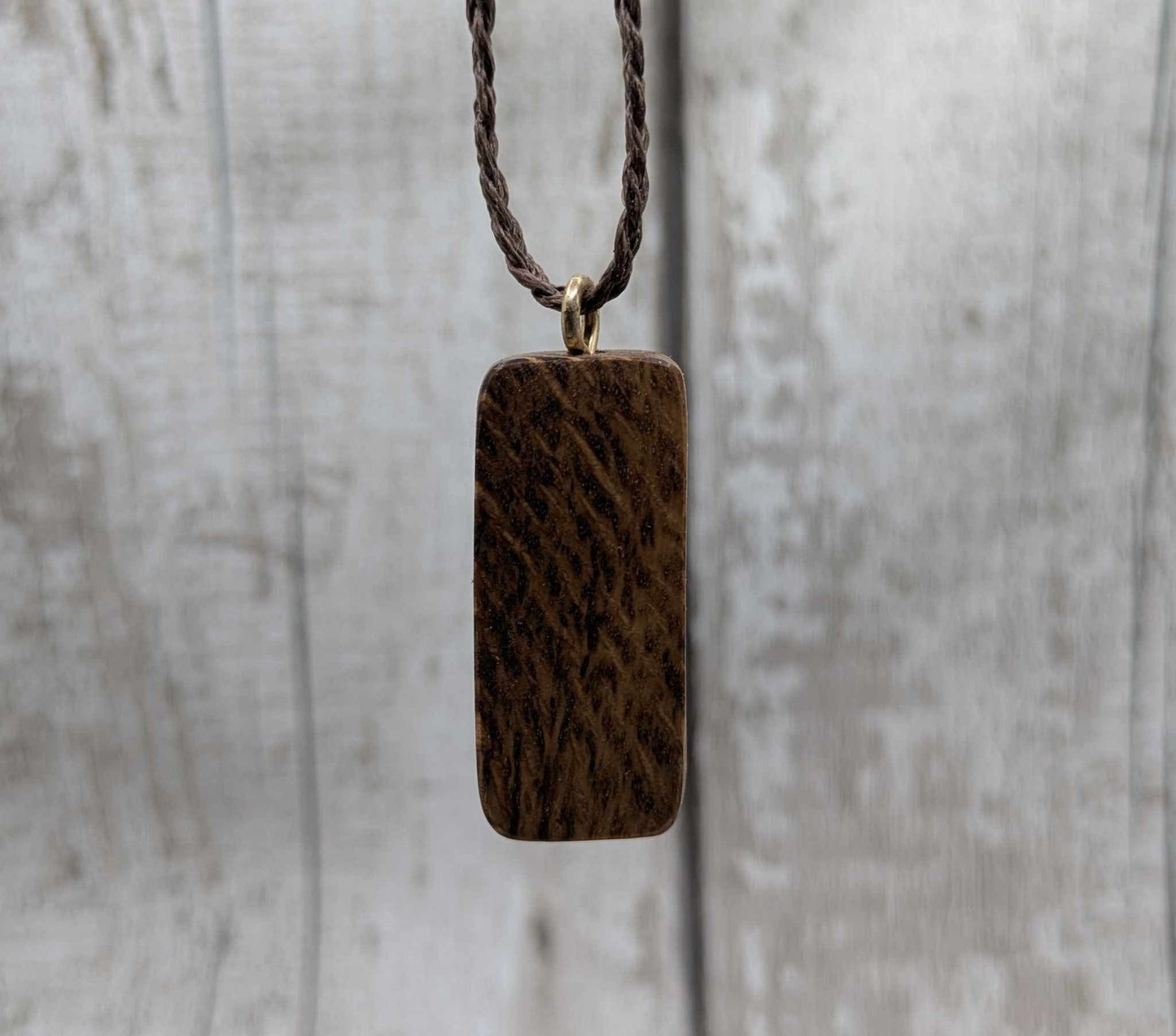 Olive wood thurisaz rune pendant.