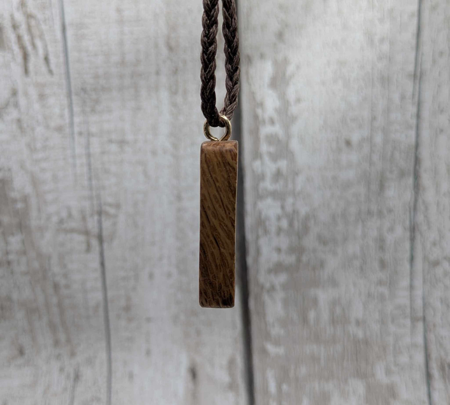Olive wood thurisaz rune pendant.