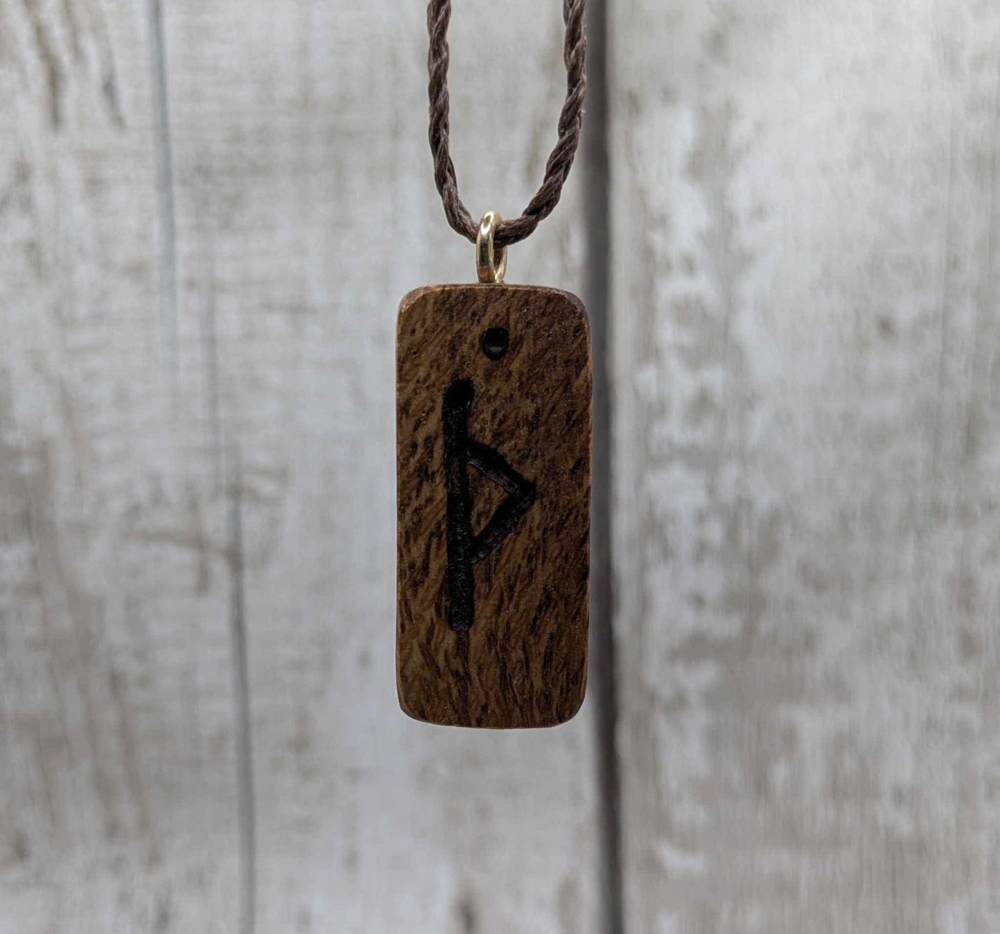 Olive wood thurisaz rune pendant.