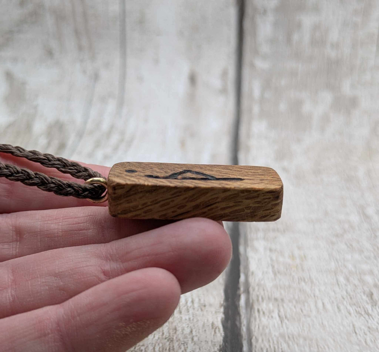 Olive wood thurisaz rune pendant.