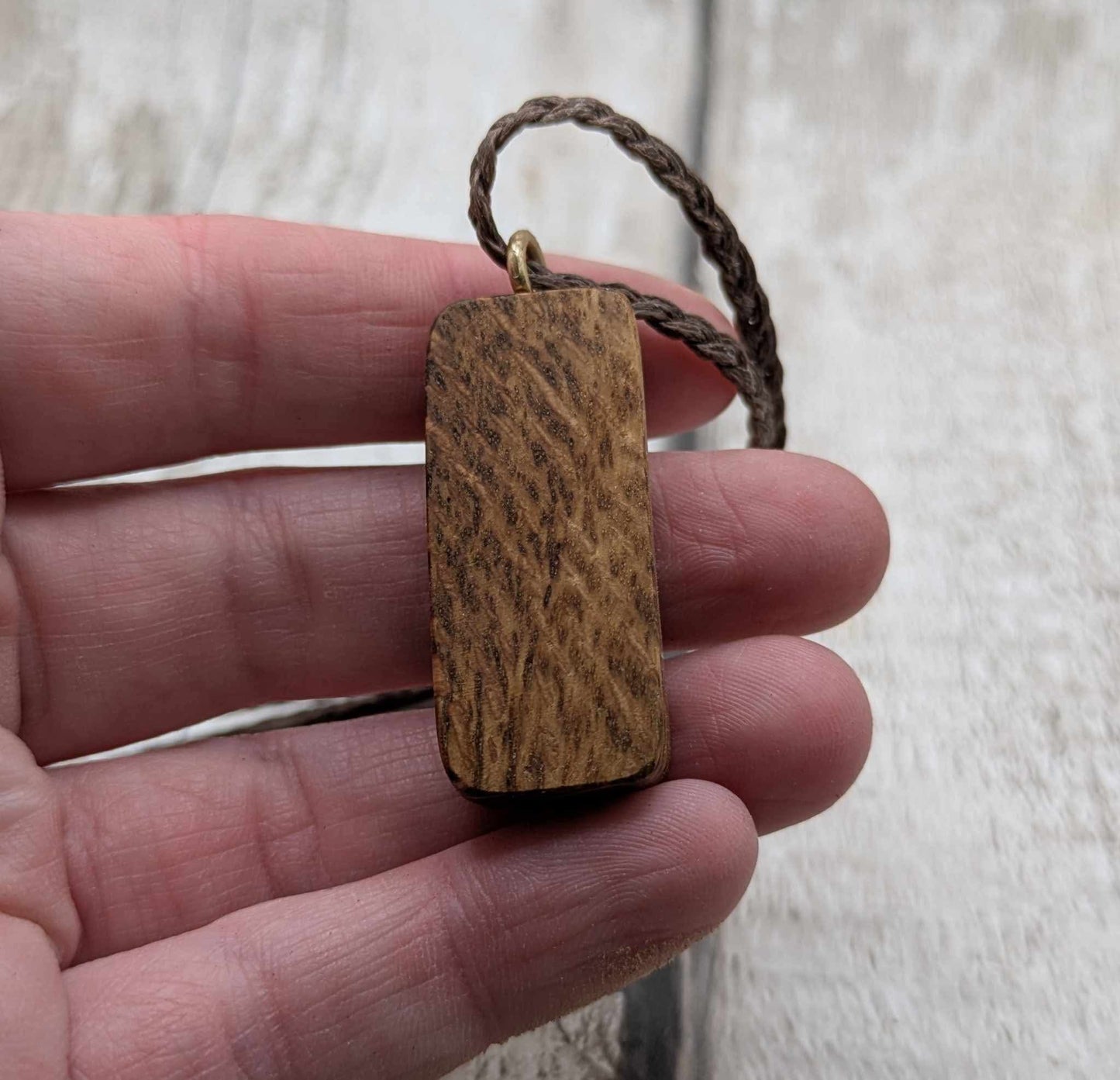 Olive wood thurisaz rune pendant.