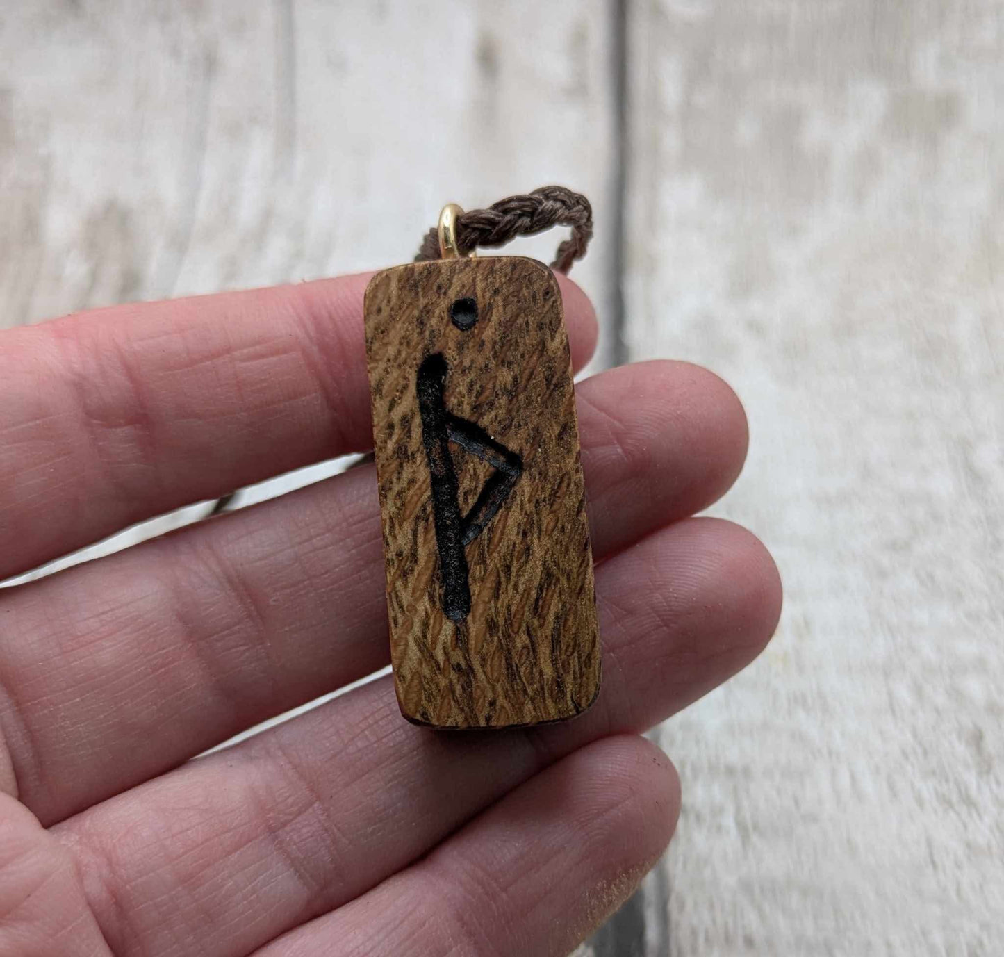 Olive wood thurisaz rune pendant.