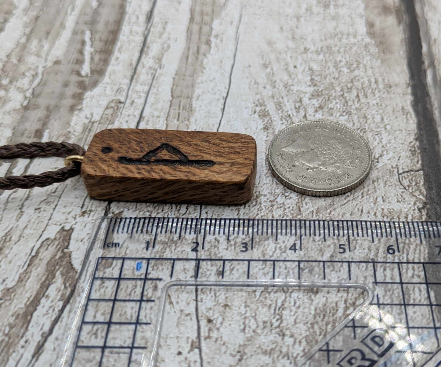 Olive wood thurisaz rune pendant.
