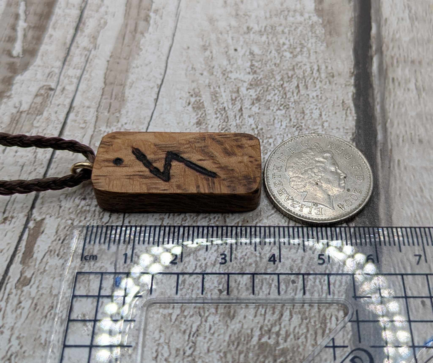 Olive wood sowulo rune pendant.