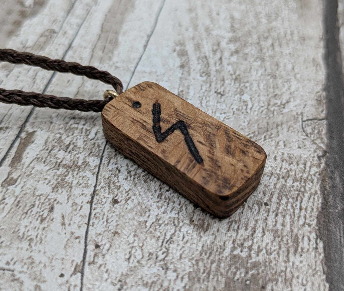 Olive wood sowulo rune pendant.
