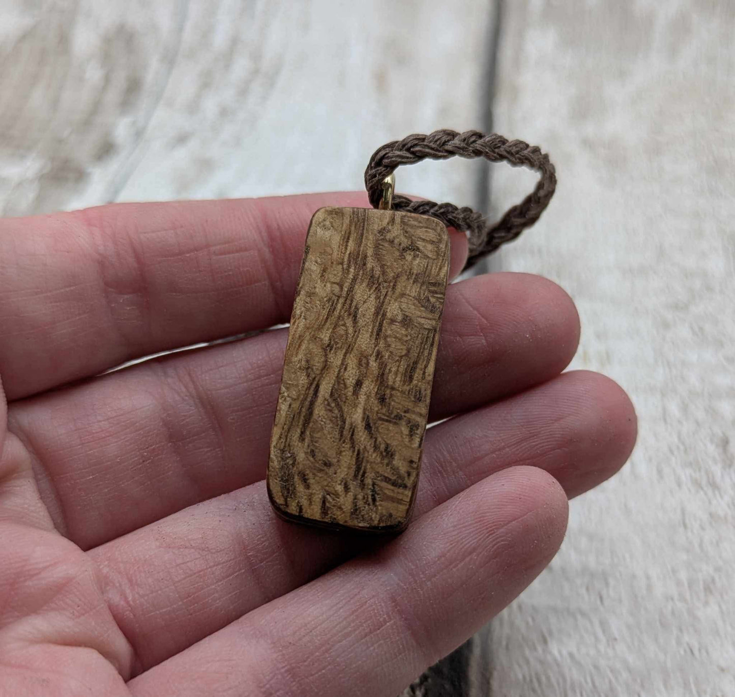 Olive wood sowulo rune pendant.