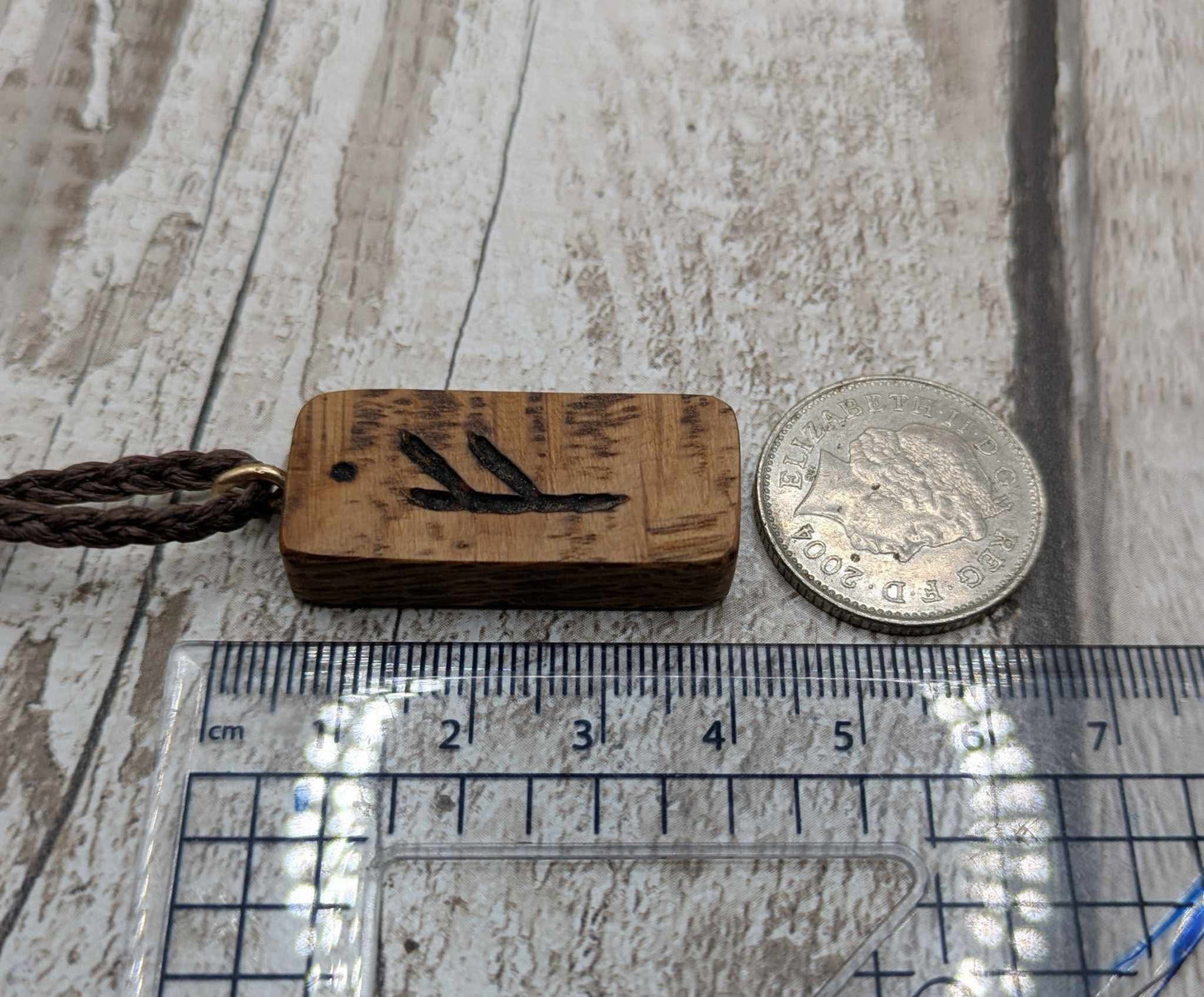 Olive wood fehu rune pendant,