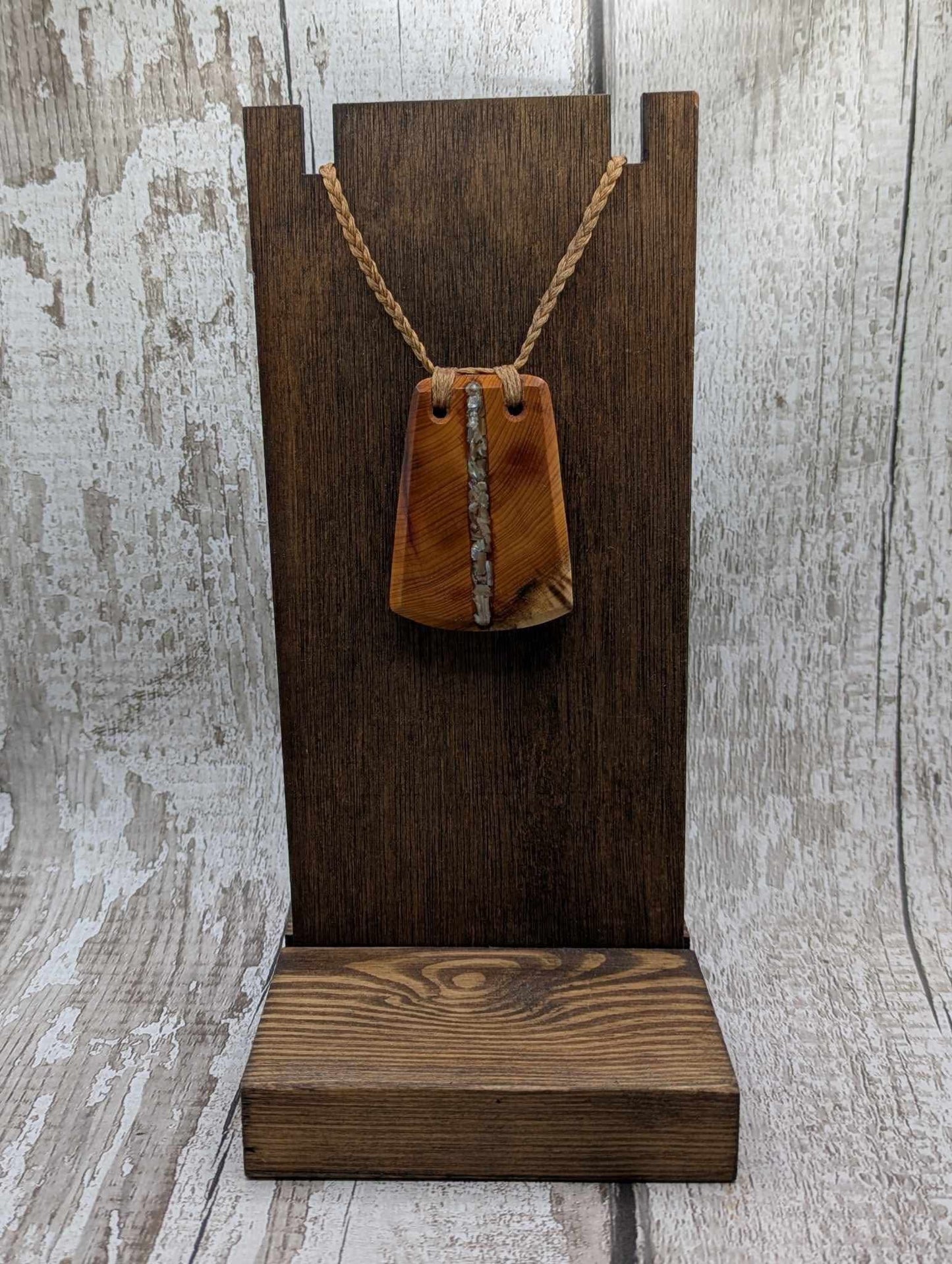 Yew wood with abalone shell inlay pendant.