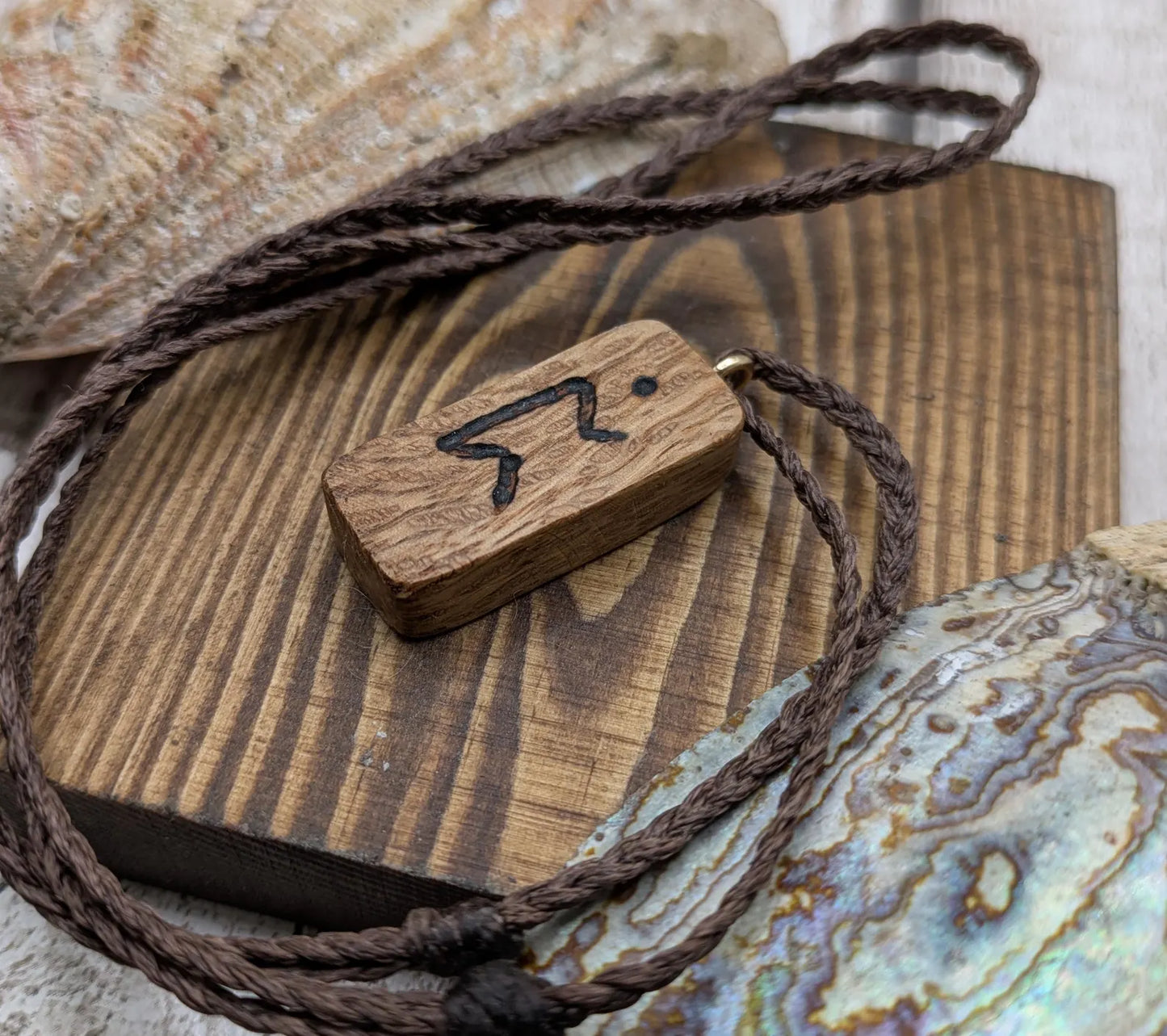 Olive wood purthro rune pendant.