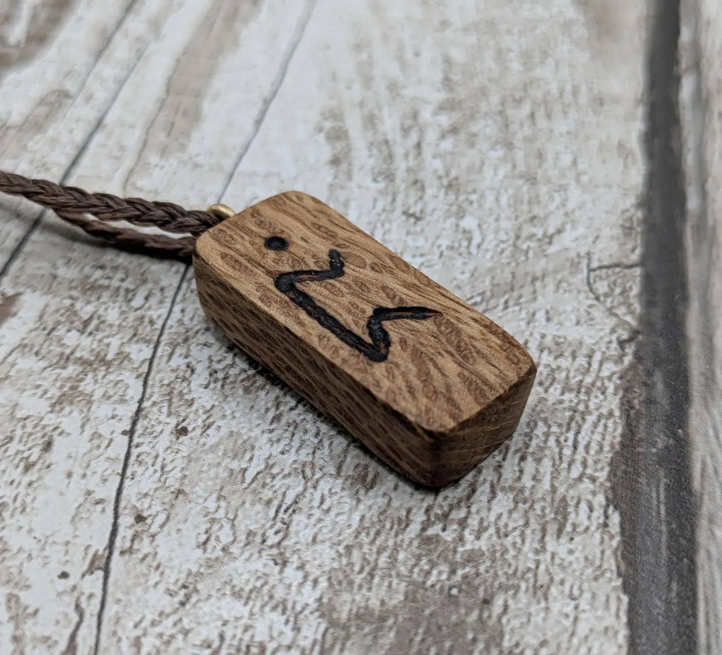 Olive wood purthro rune pendant.