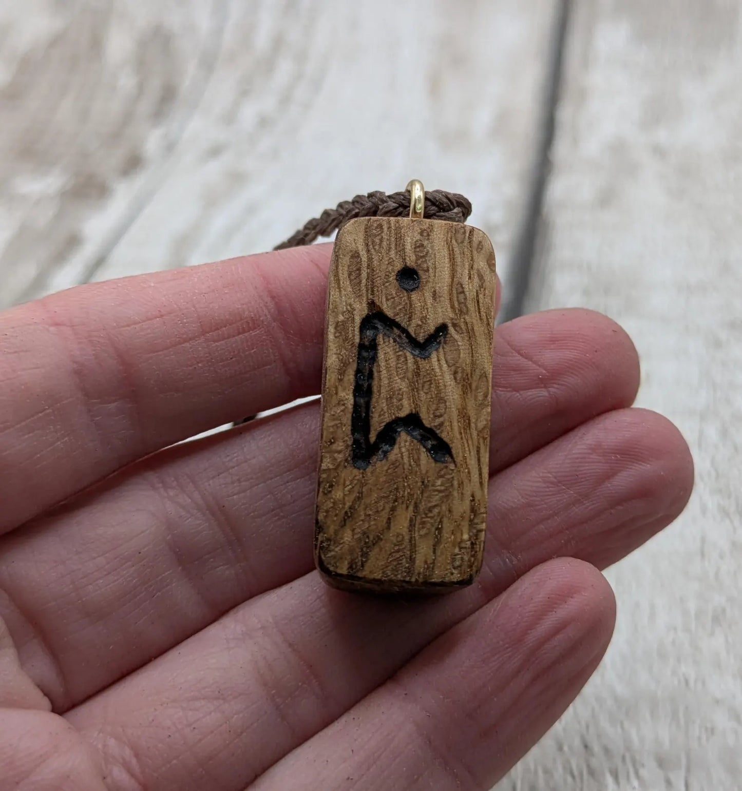 Olive wood purthro rune pendant.