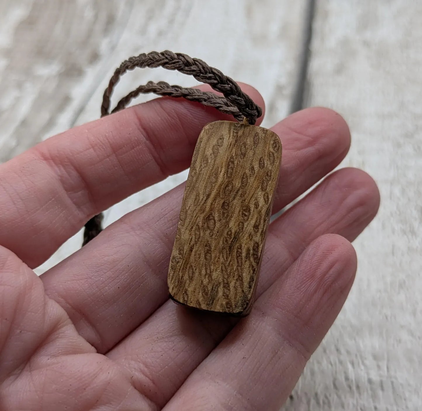 Olive wood purthro rune pendant.