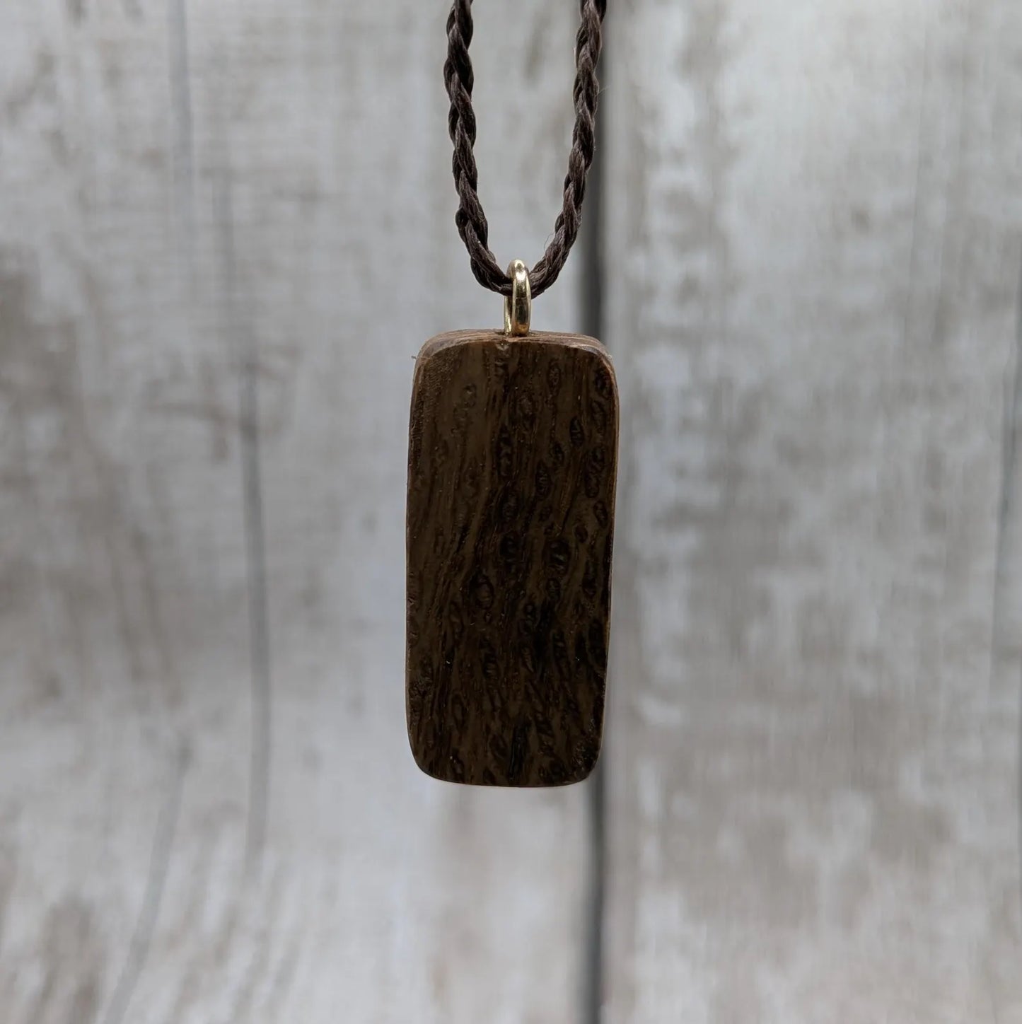 Olive wood purthro rune pendant.