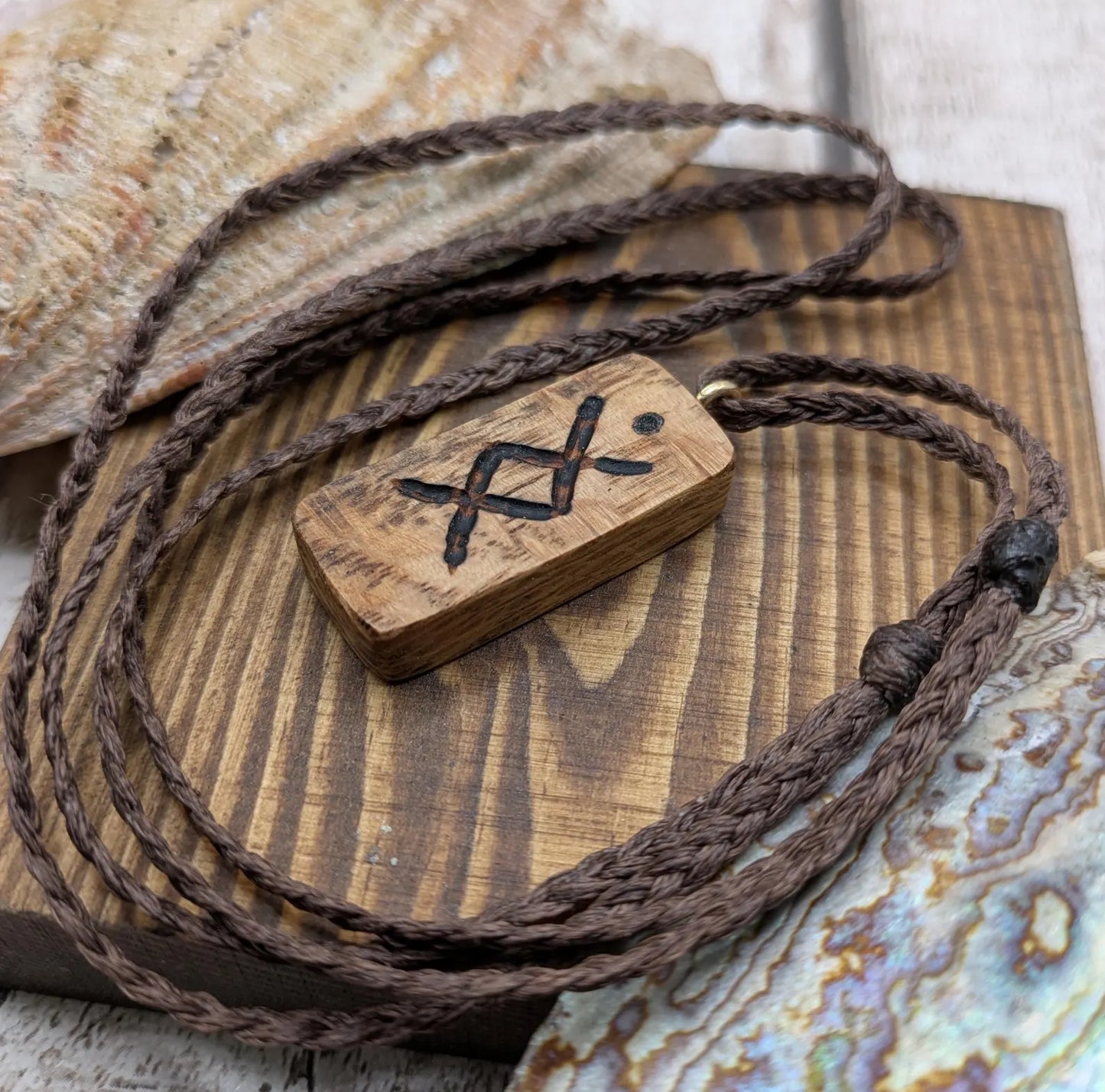 Olive wood ingwaz rune pendant.