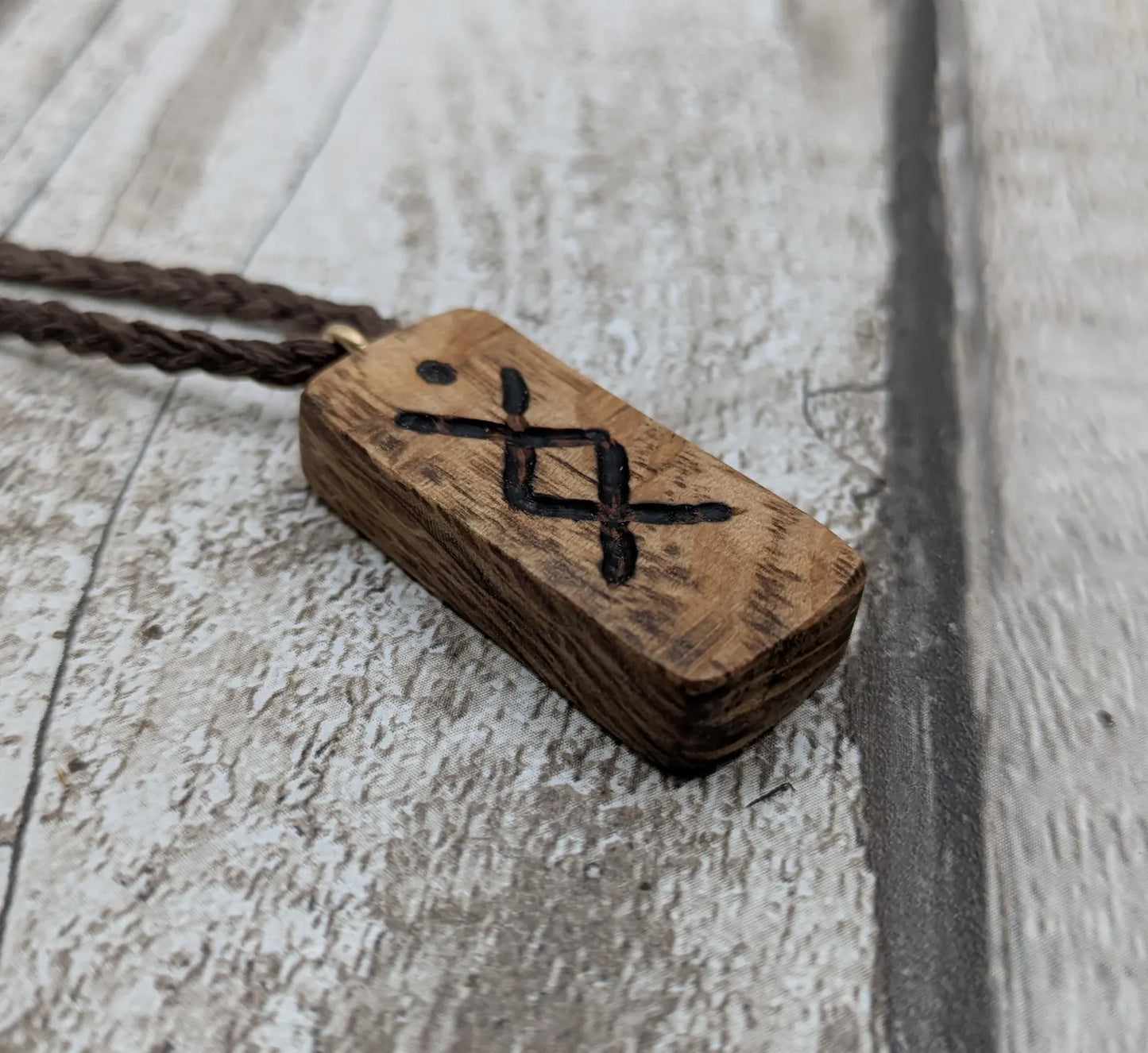 Olive wood ingwaz rune pendant.