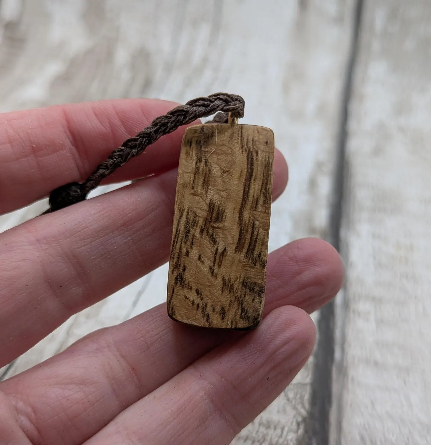 Olive wood ingwaz rune pendant.