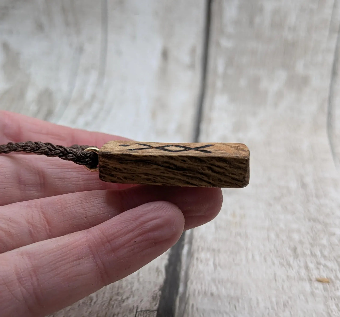 Olive wood ingwaz rune pendant.