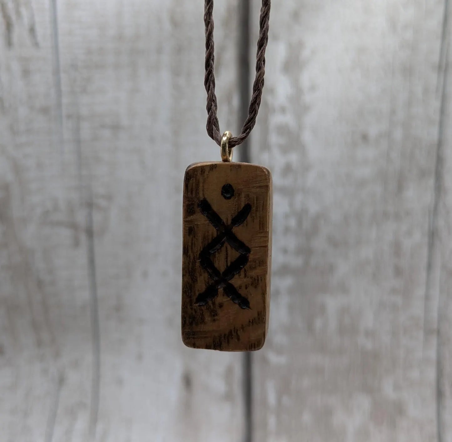 Olive wood ingwaz rune pendant.