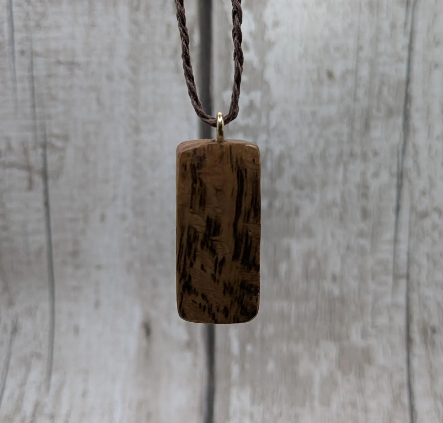 Olive wood ingwaz rune pendant.