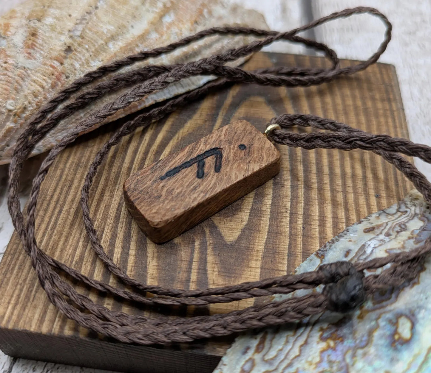 Olive wood ansuz rune pendant.