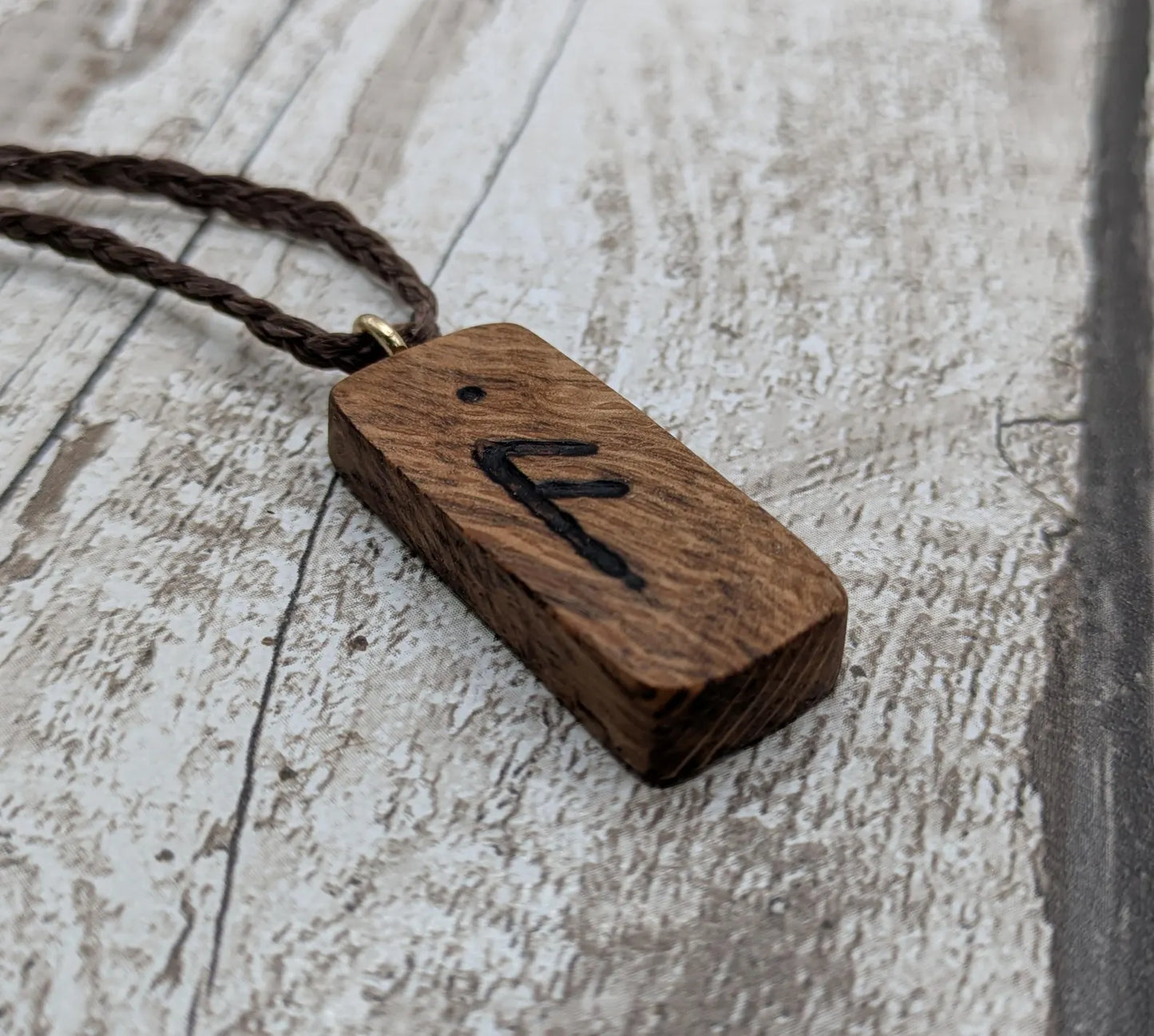 Olive wood ansuz rune pendant.