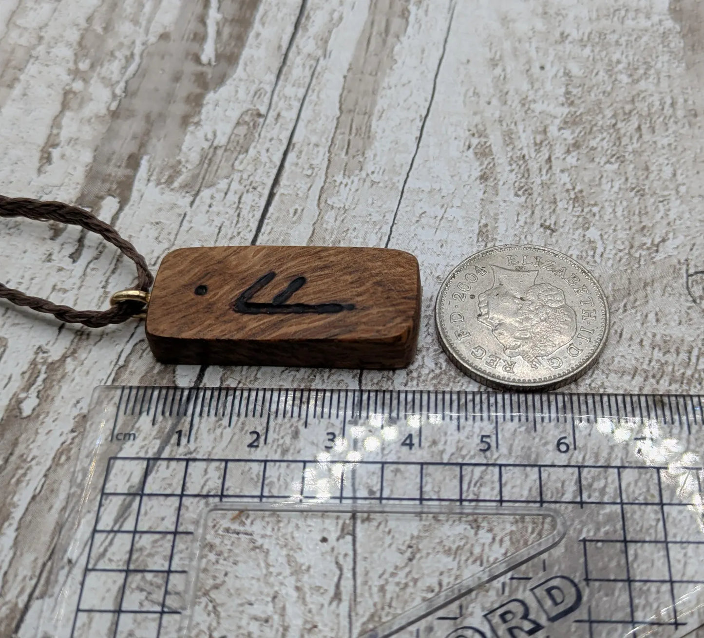Olive wood ansuz rune pendant.