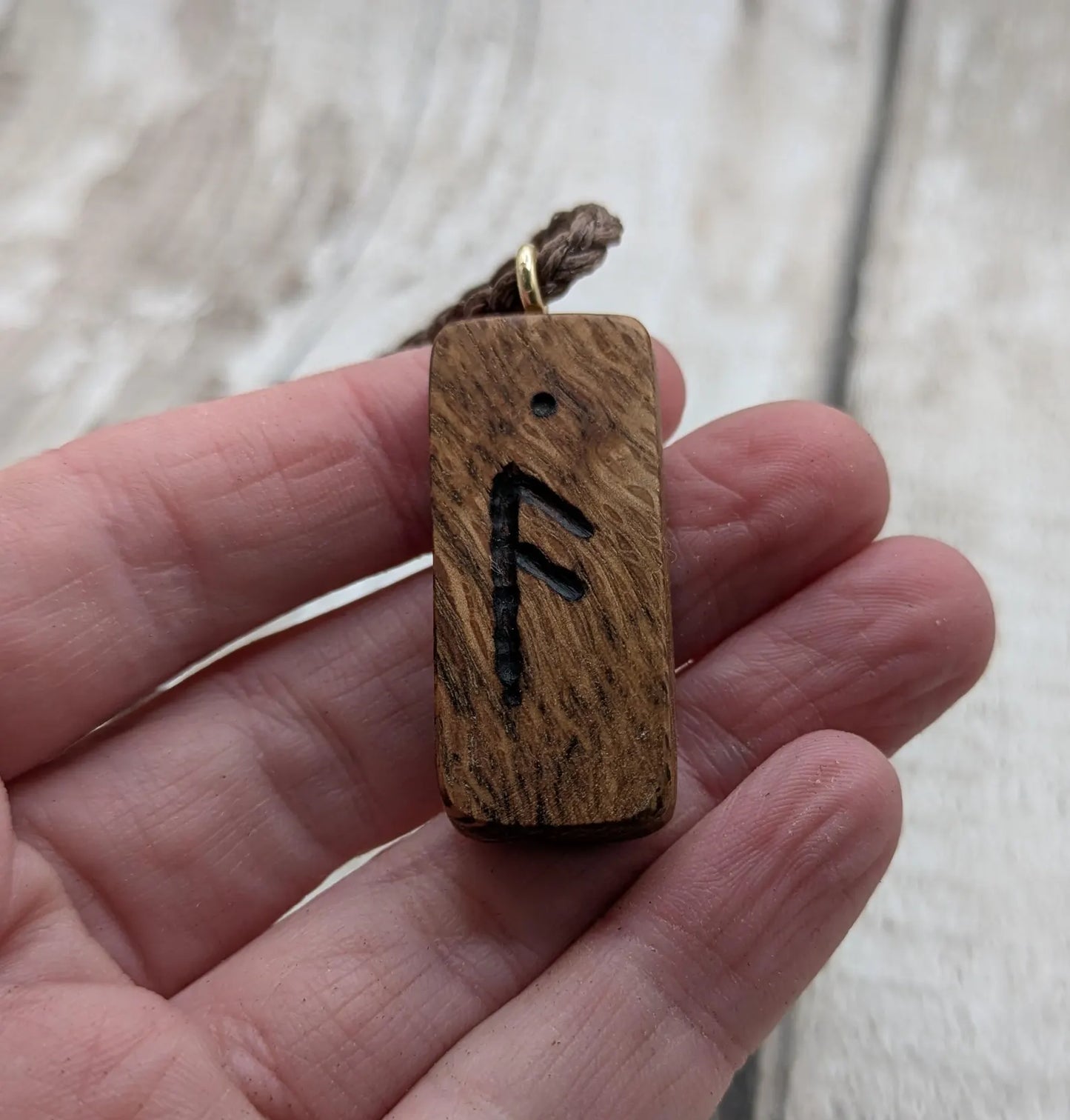 Olive wood ansuz rune pendant.