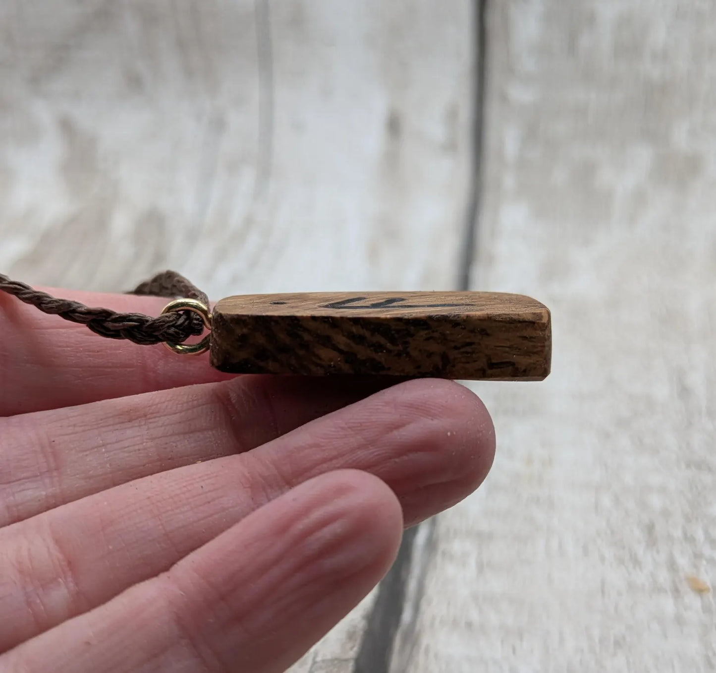 Olive wood ansuz rune pendant.