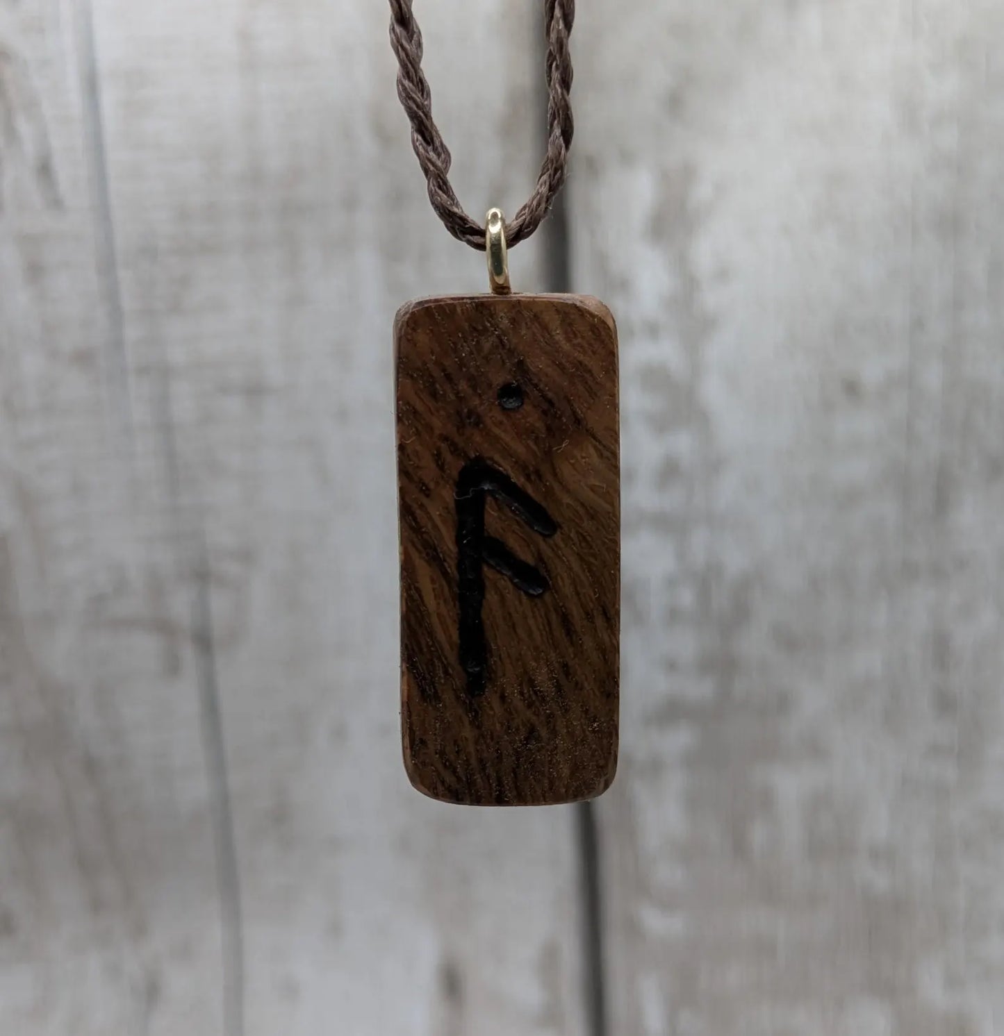 Olive wood ansuz rune pendant.