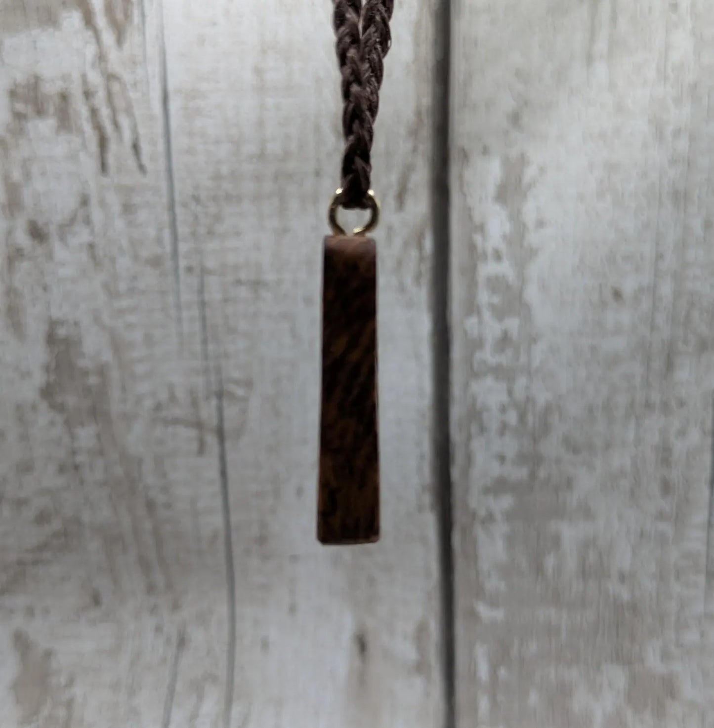 Olive wood ansuz rune pendant.