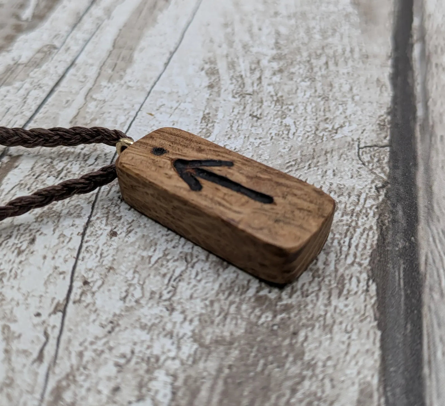 Olive wood tiwaz rune pendant.