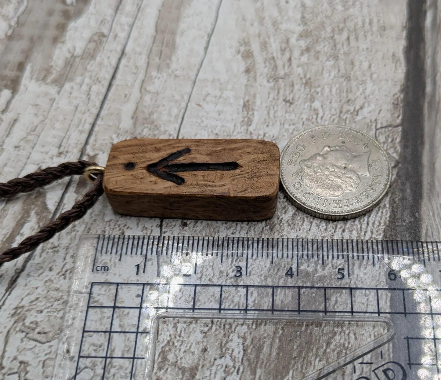 Olive wood tiwaz rune pendant.