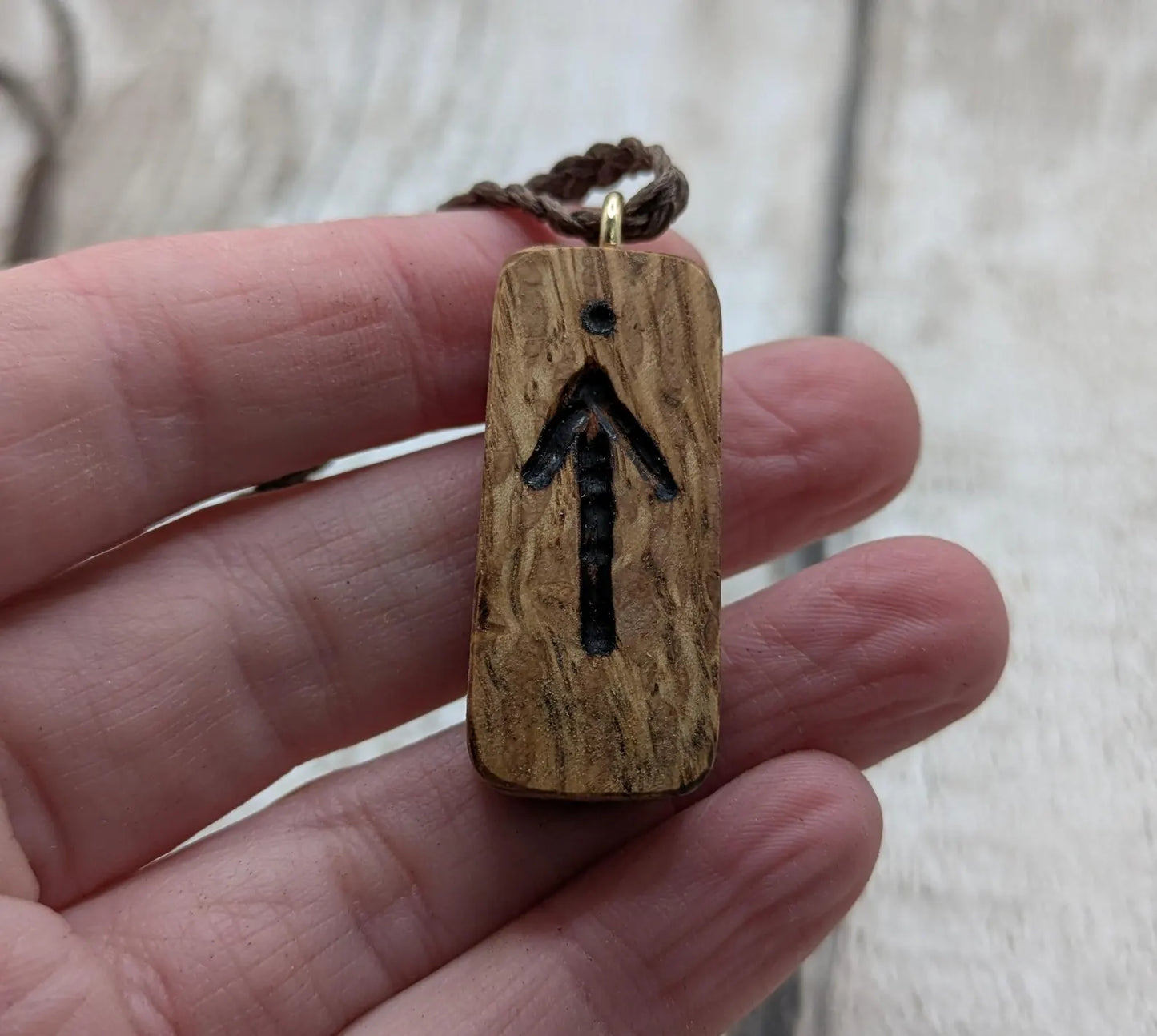 Olive wood tiwaz rune pendant.