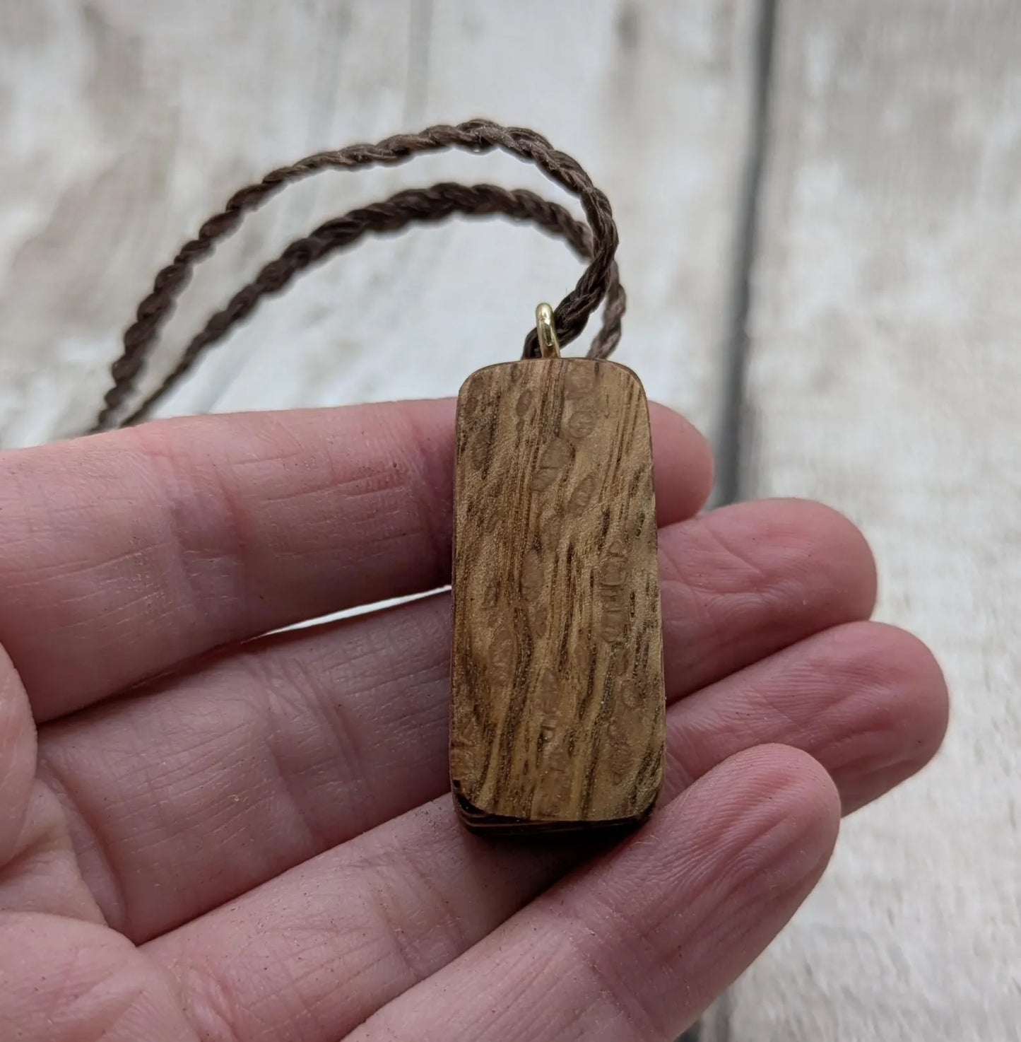Olive wood tiwaz rune pendant.