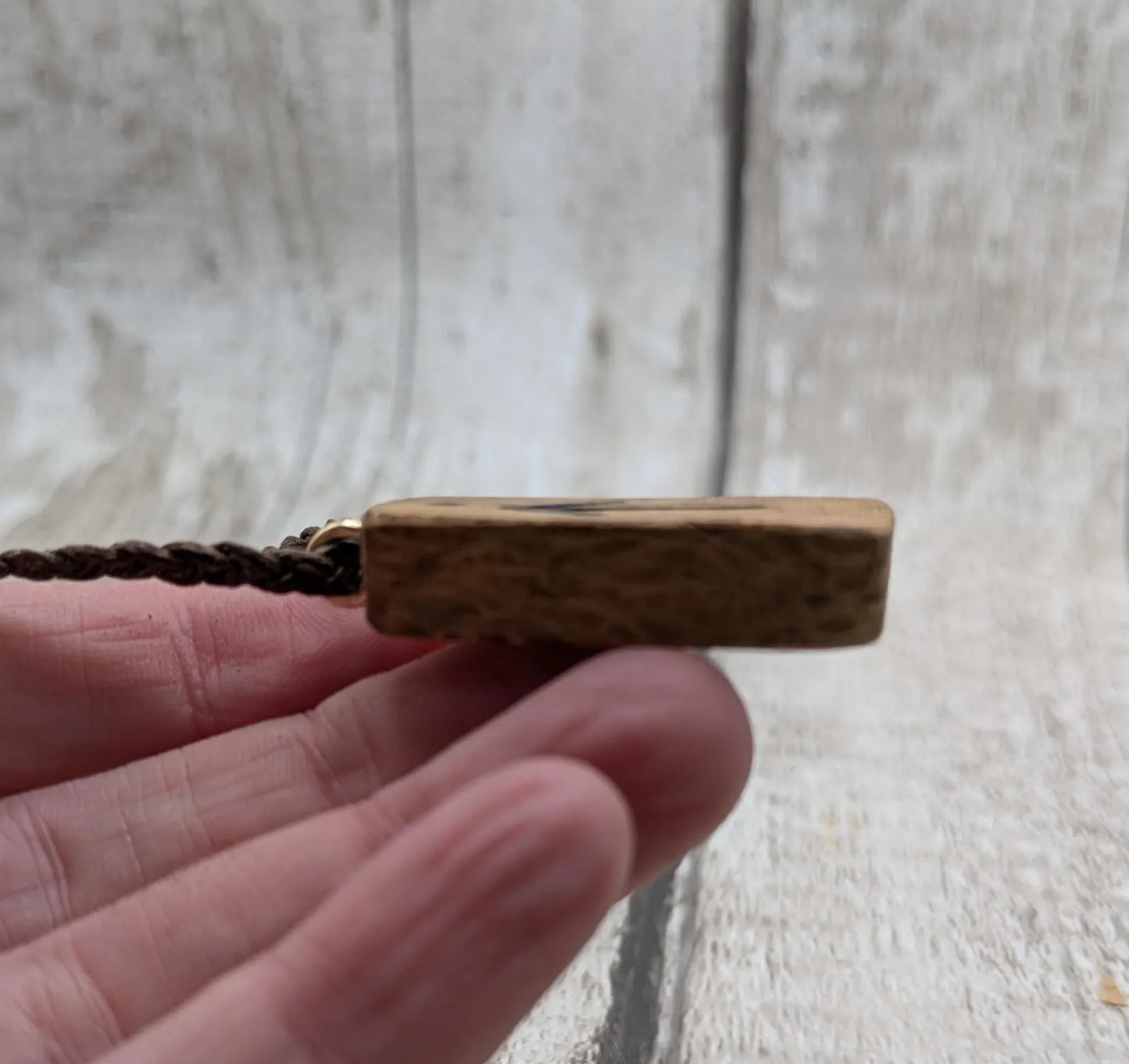 Olive wood tiwaz rune pendant.
