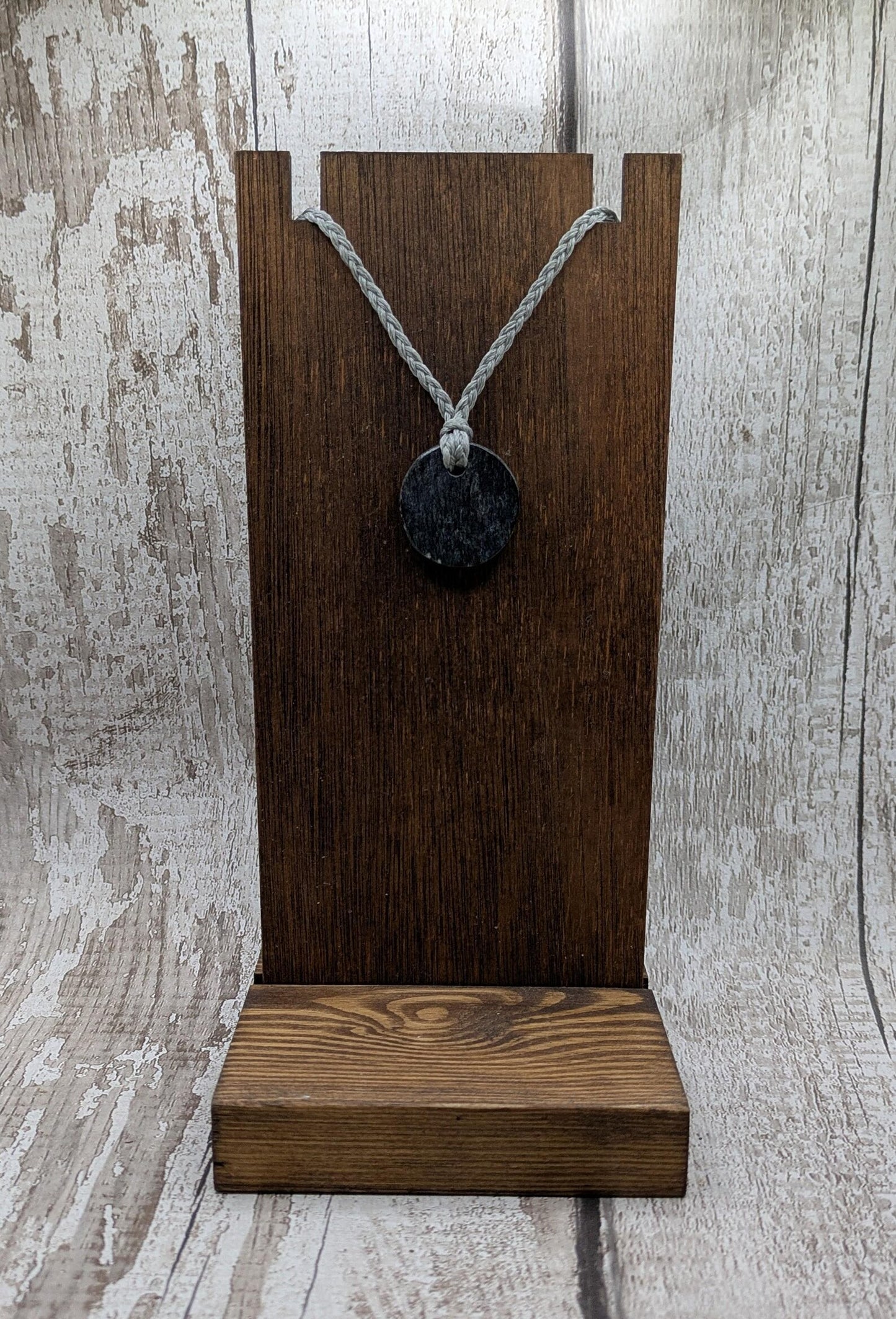 Low grade Shungite disc pendant, hight mica content.