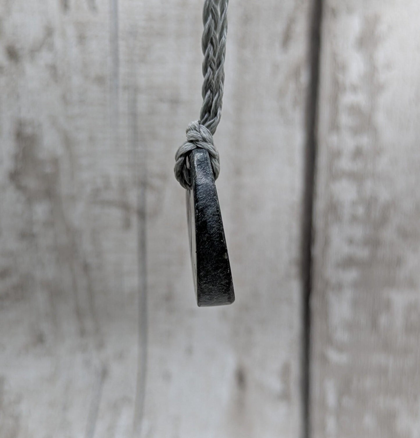 Low grade Shungite asymmetric disc pendants.