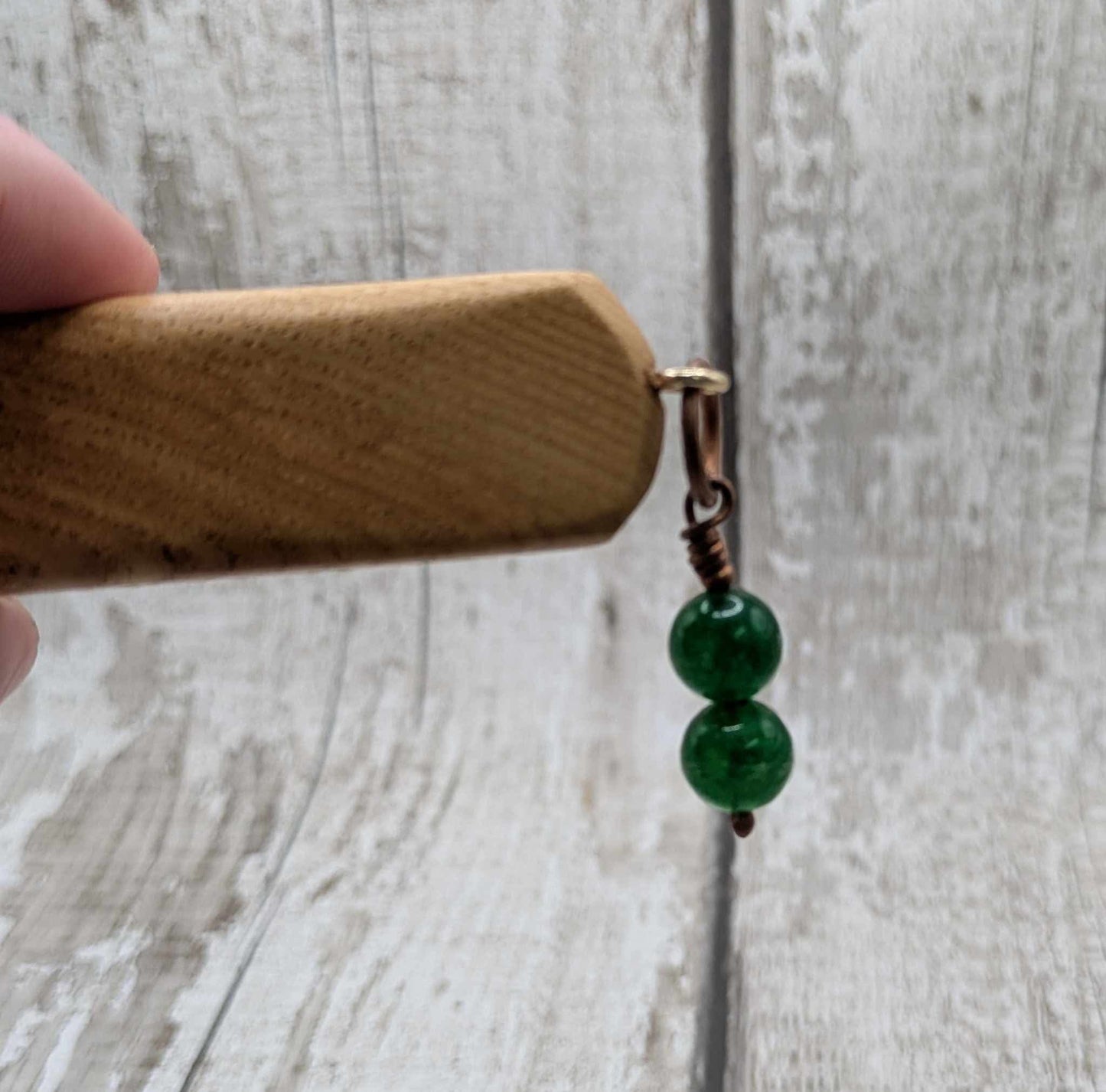 Oak wood curved hair stick with jade charm.