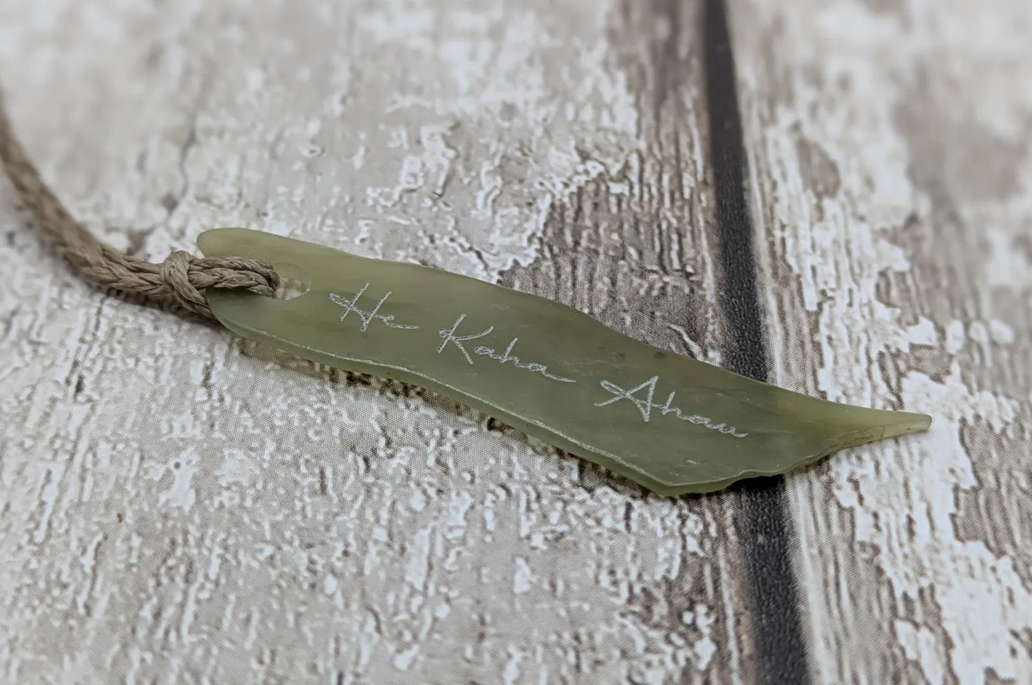 New Zealand tumbled Pounamu greenstone pendant with I am strong in te Reo Māori.