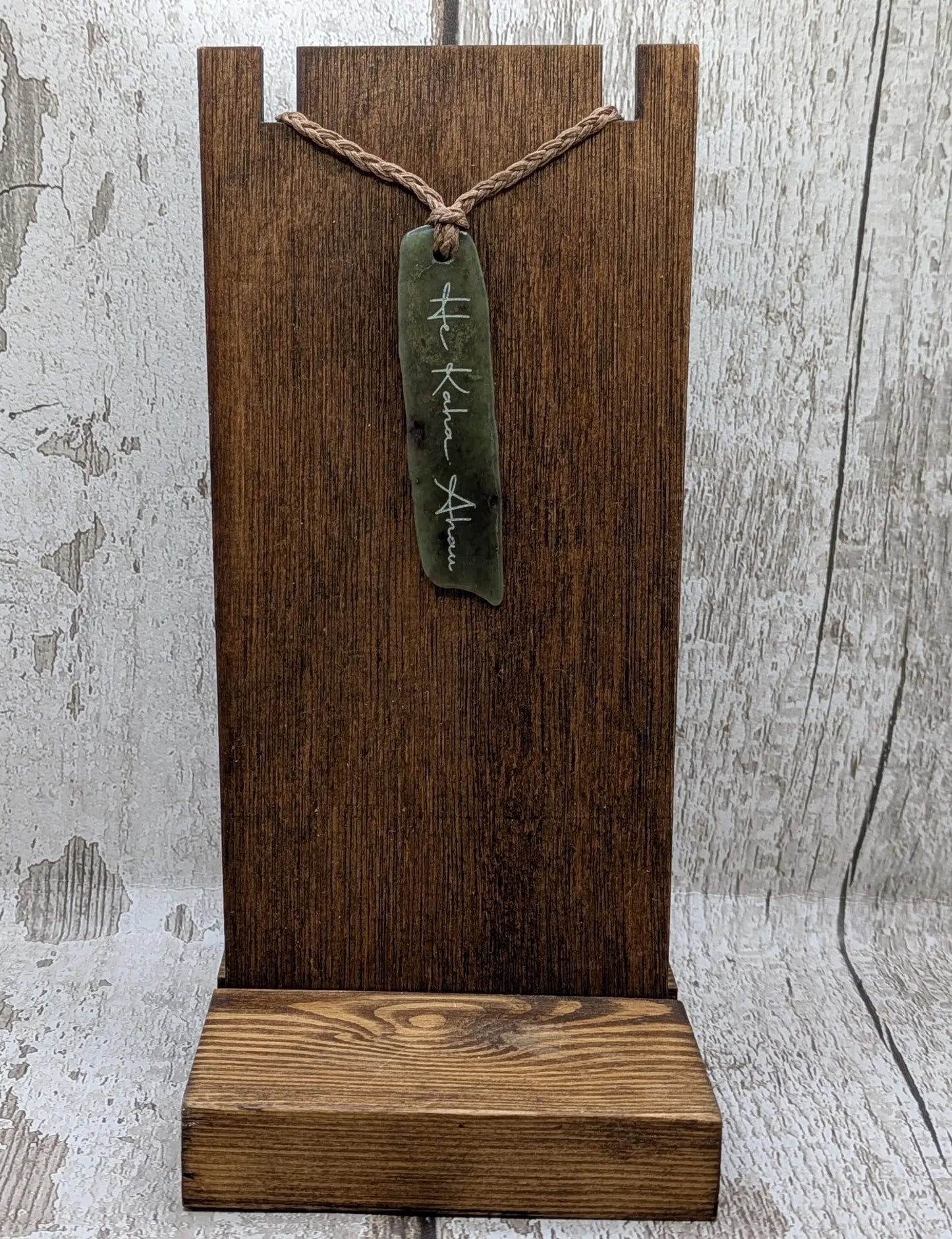 Tumble polished New Zealand Pounamu greenstone jade slice pendant with I am strong in te Reo Māori