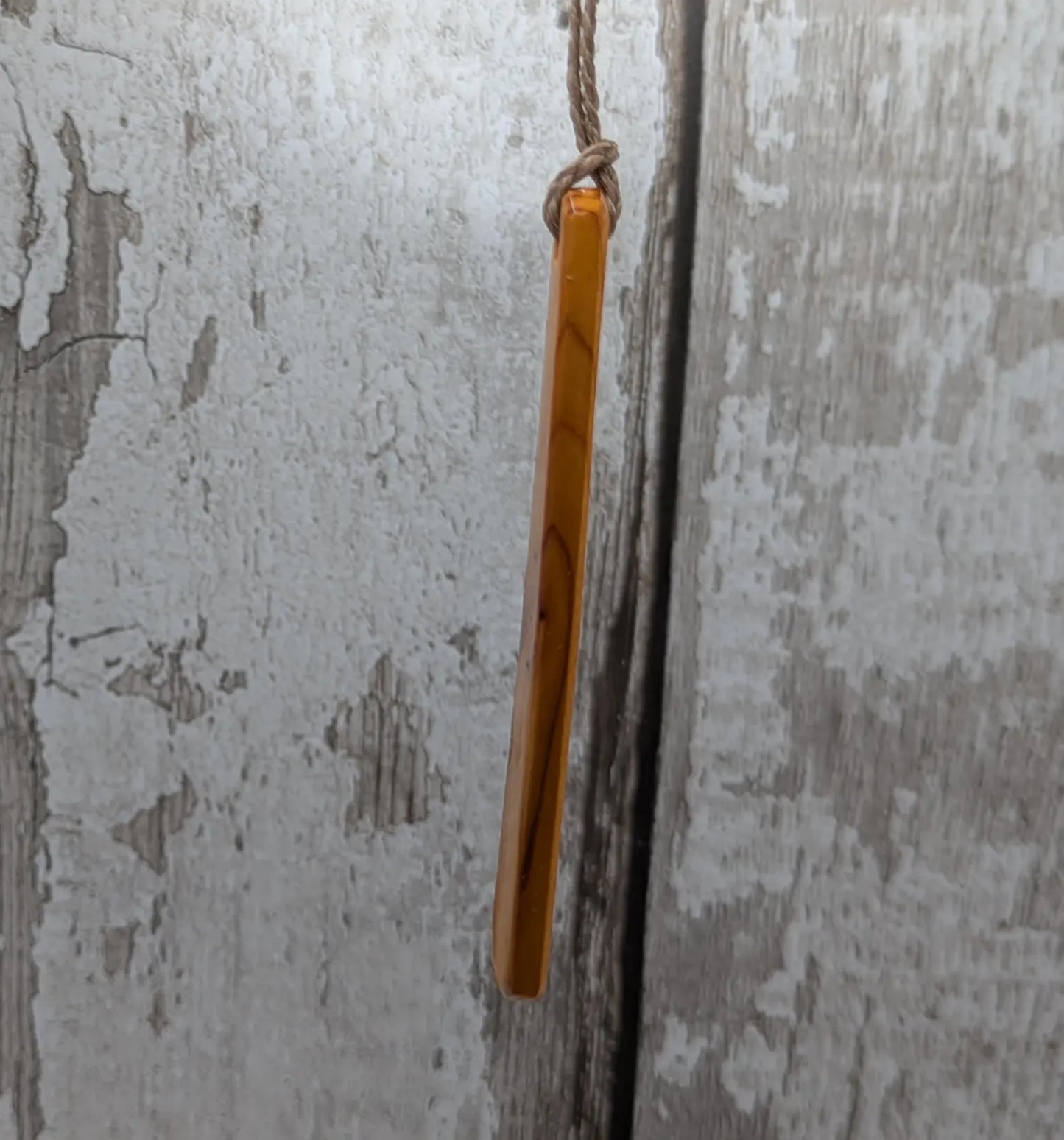 Yew wood roimata pendant with te reo māori He kaha ahau, I am strong.