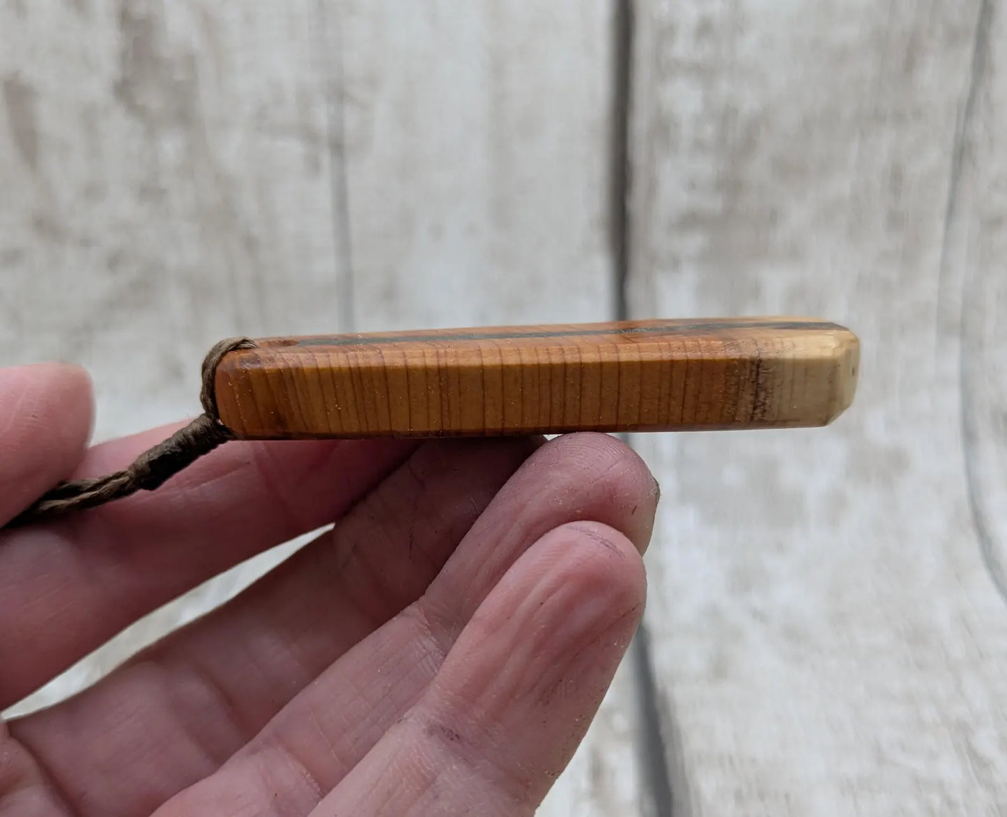 Yew wood roimata drop pendant with Aotea inlay.